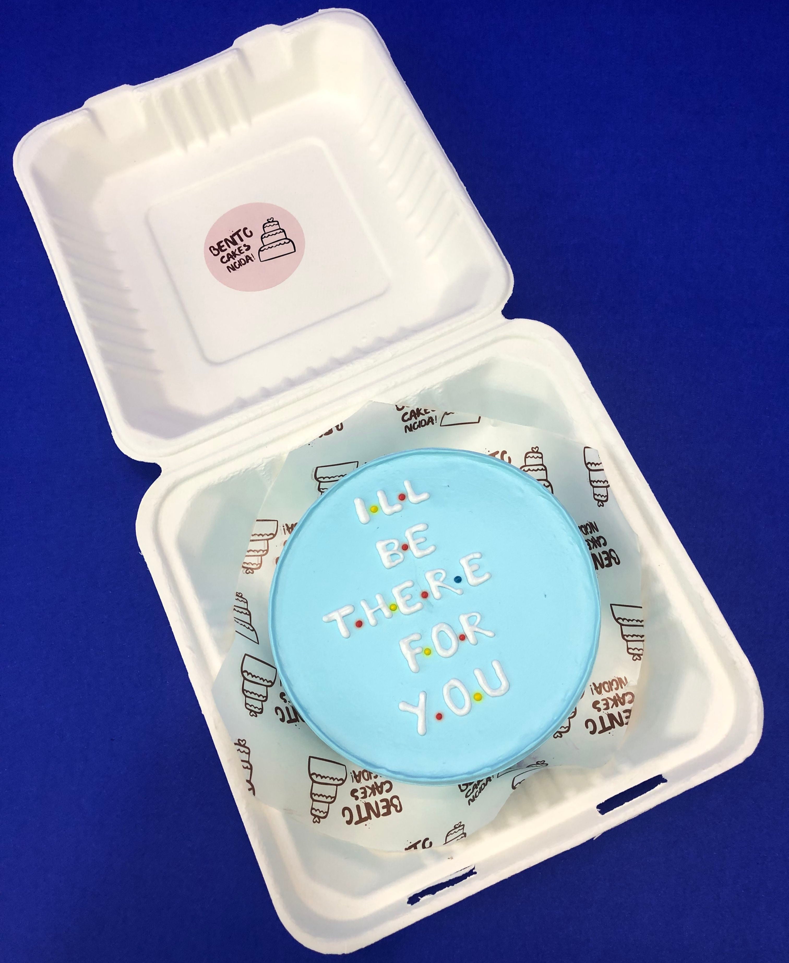 I LL BE THERE FOR YOU friendship text written with white icing on a skyblue bento cake.