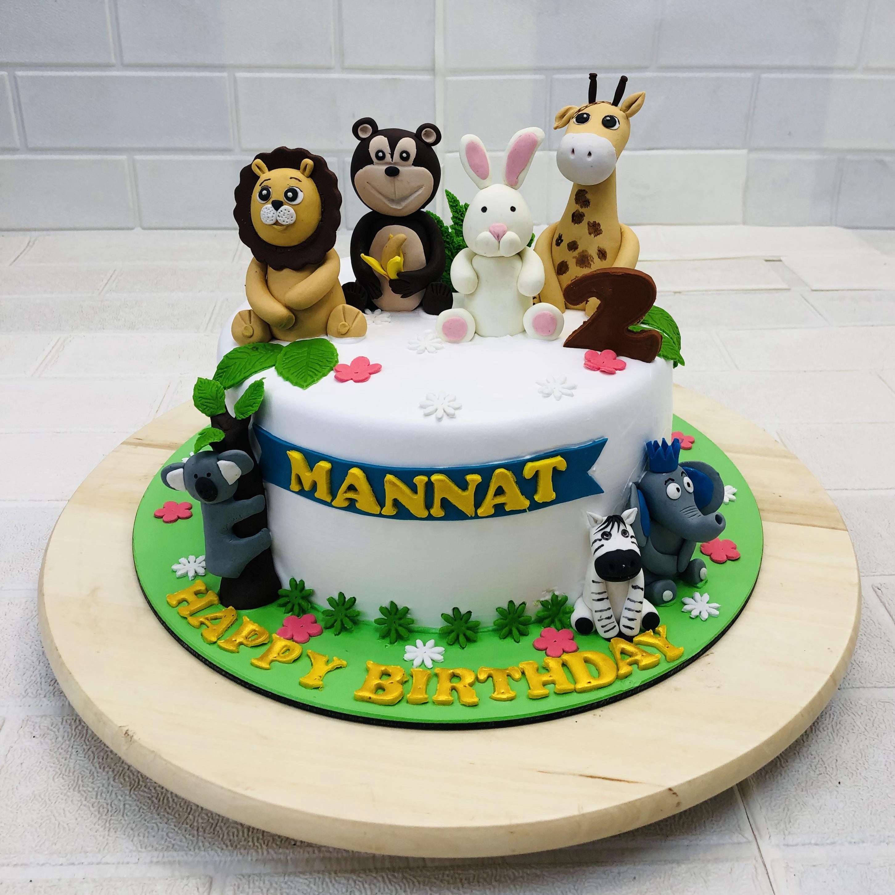 Beautifully designed cute animals theme cake for babies birthday, all animals are beautifully placed and ready for celebration.