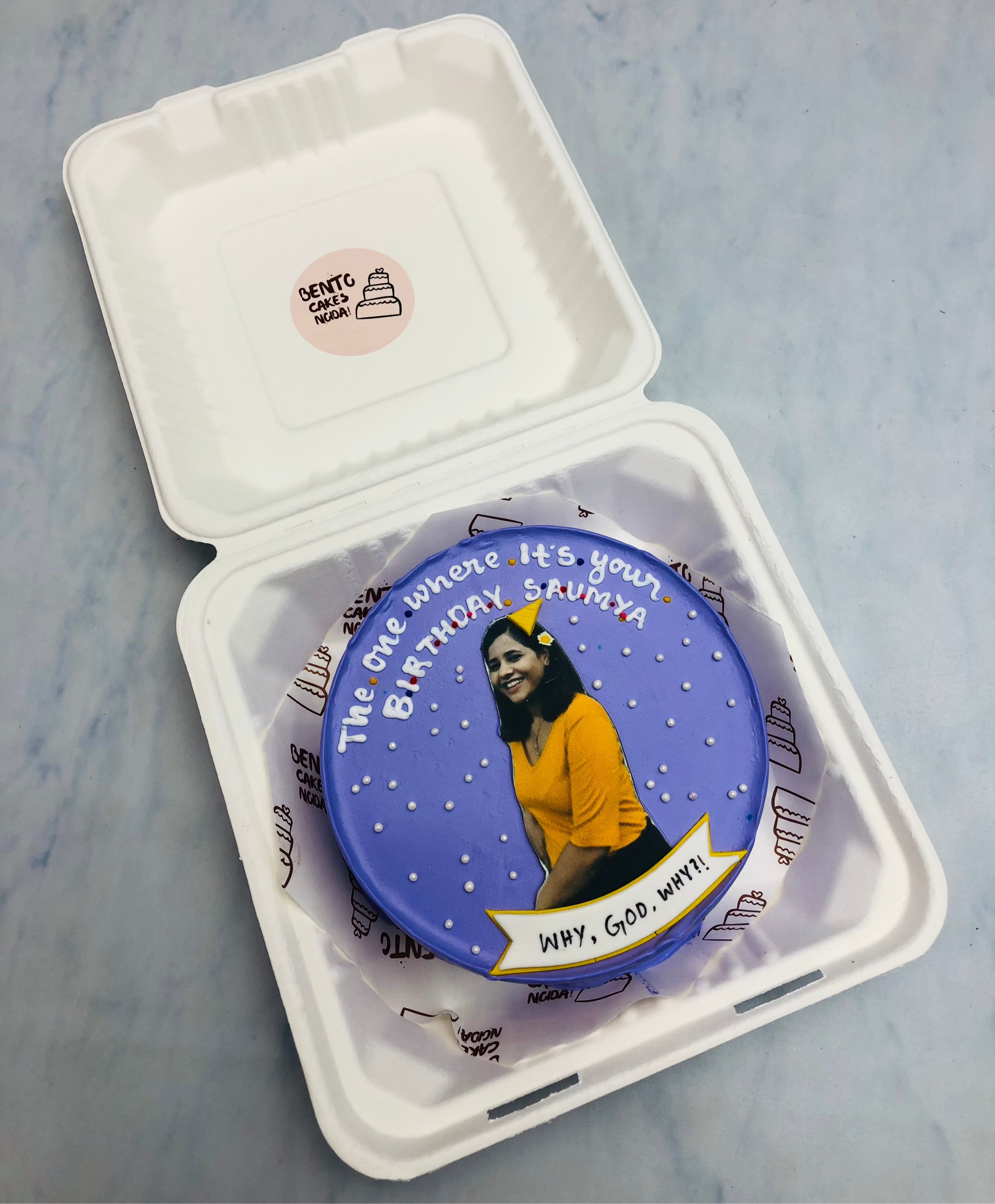 A blue bento cake with friends popular show theme celebrating birthday.