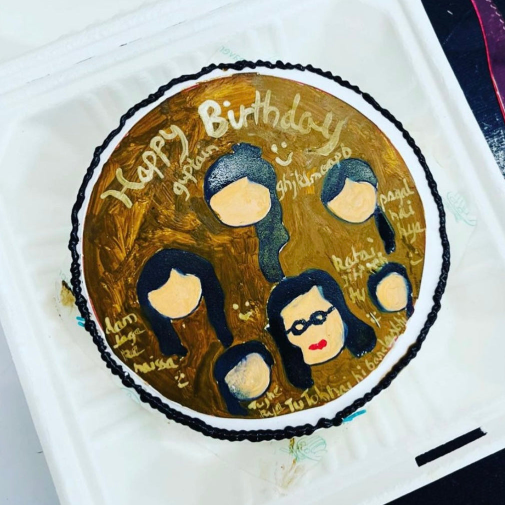 A decorated cake featuring an edible image of a group of people, showcasing a celebratory theme.