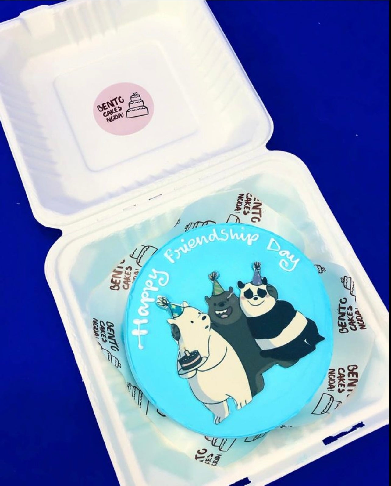 A light blue bento cake with 3 bear friends print for friendship day.