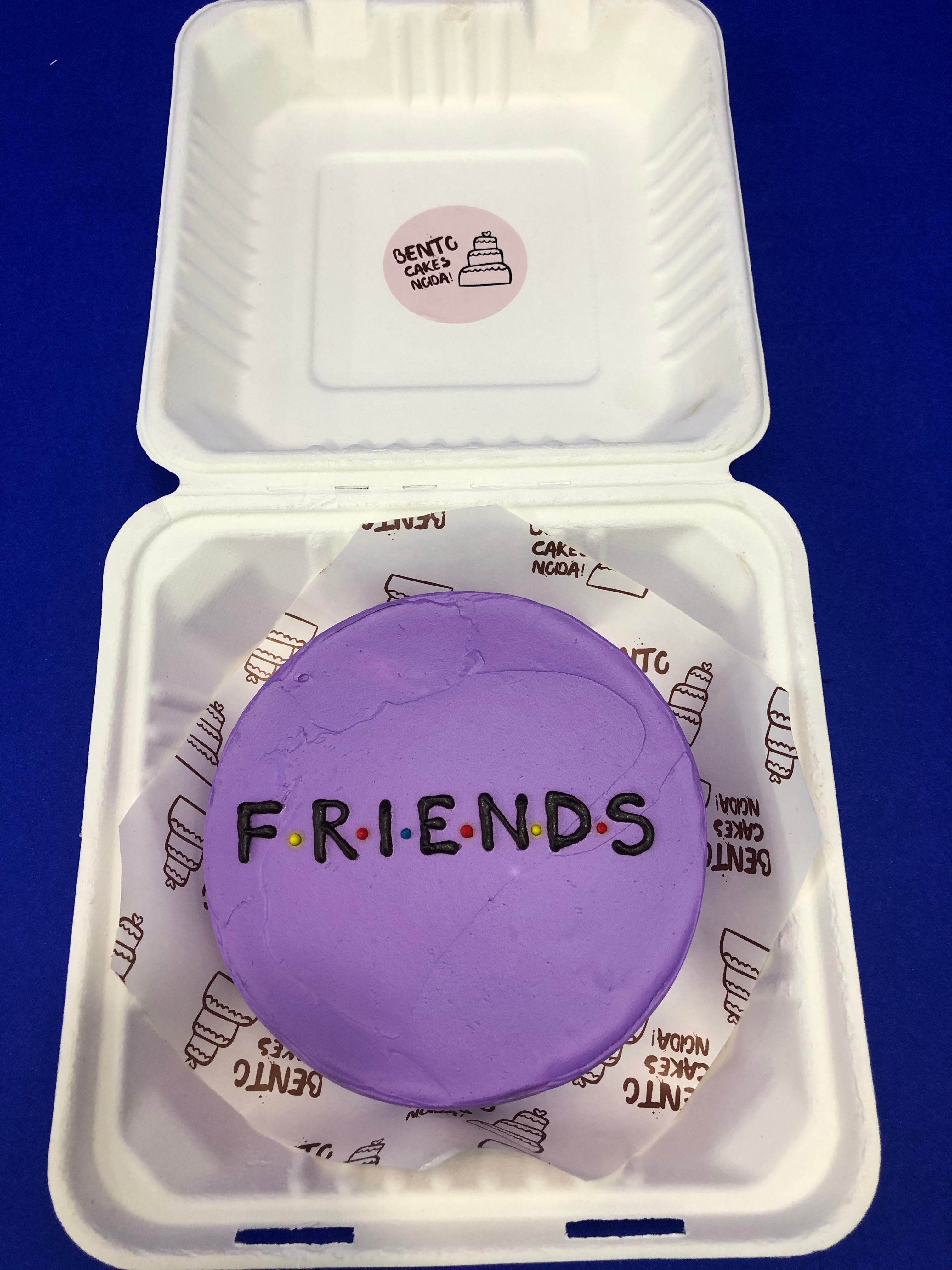 A purple bento cake having a popular tv show deisgn FRIENDS text written on it.