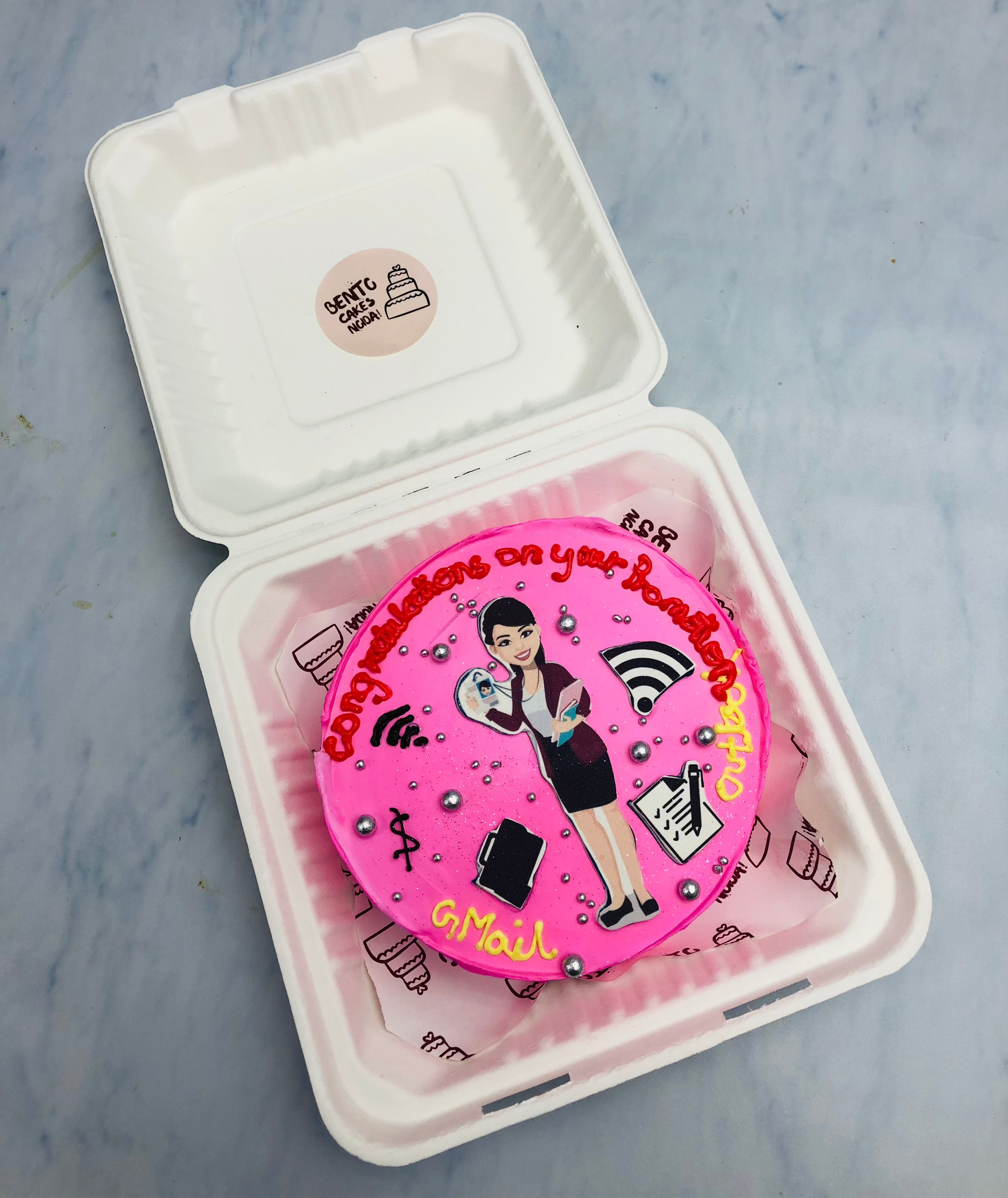 A light pink bento cake designed for a social media professional with SM prints.