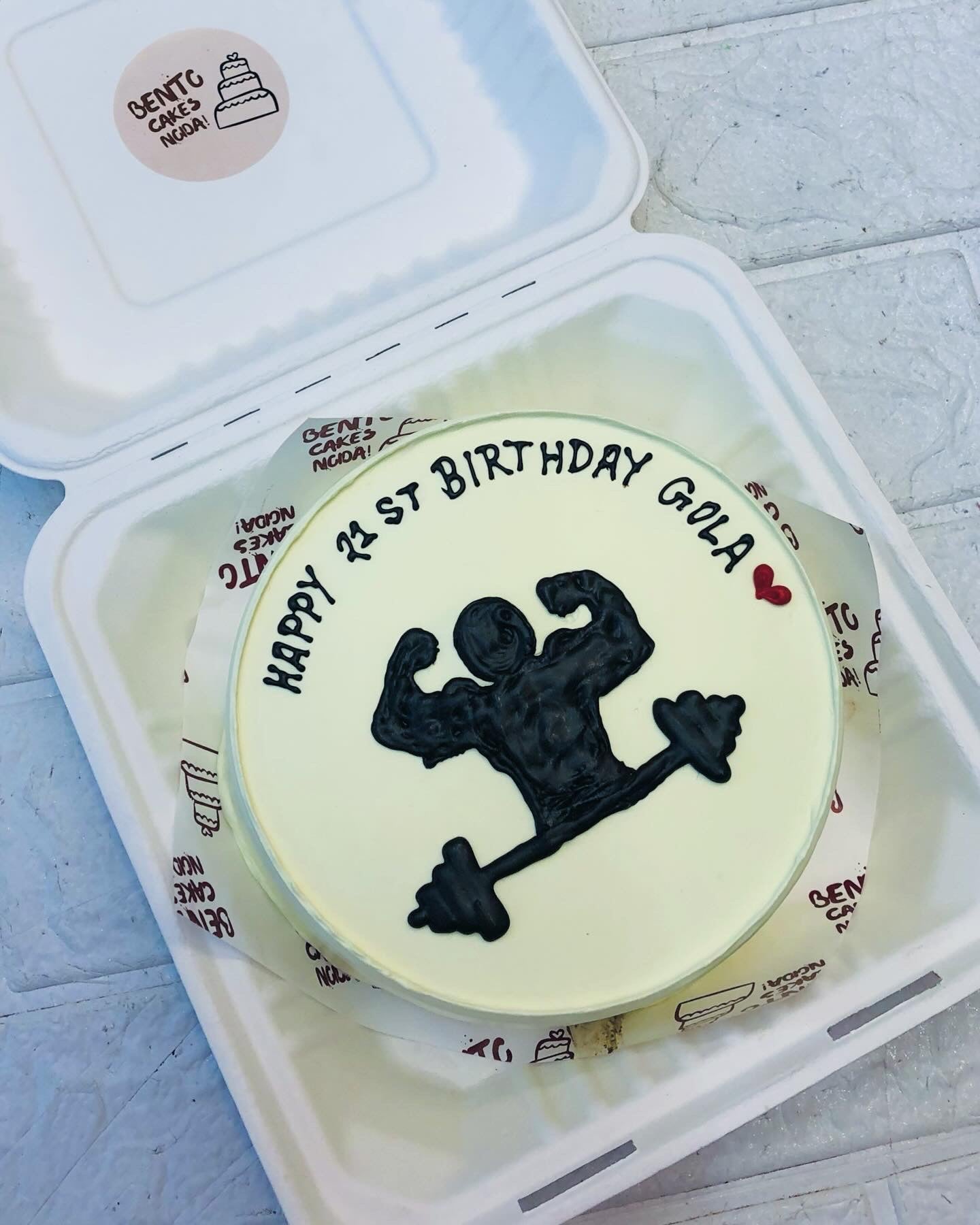 A white bento cake for Gym lovers birthday, turning 21.
