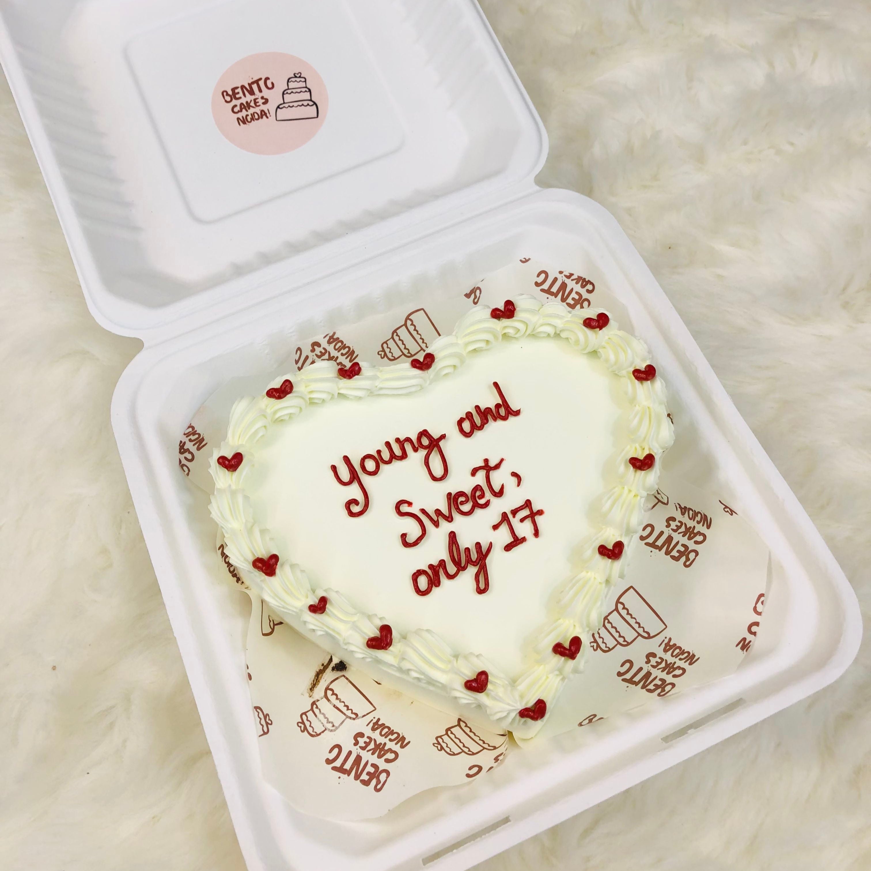 A delicious heart-shaped cake decorated with colorful frosting and sprinkles, perfect for celebrations and special occasions.