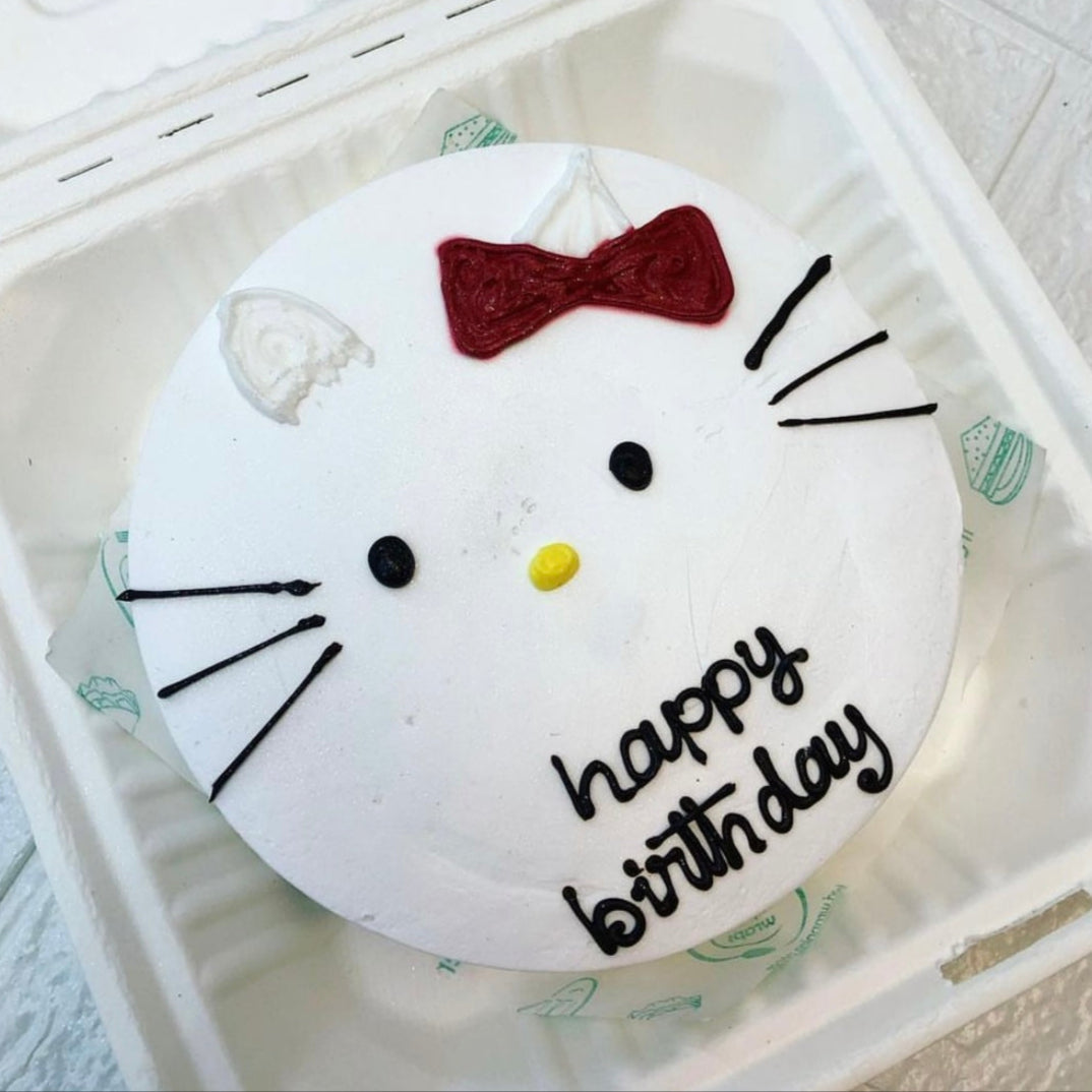A colorful Hello Kitty birthday cake nestled in a bento box, ready for a festive celebration.