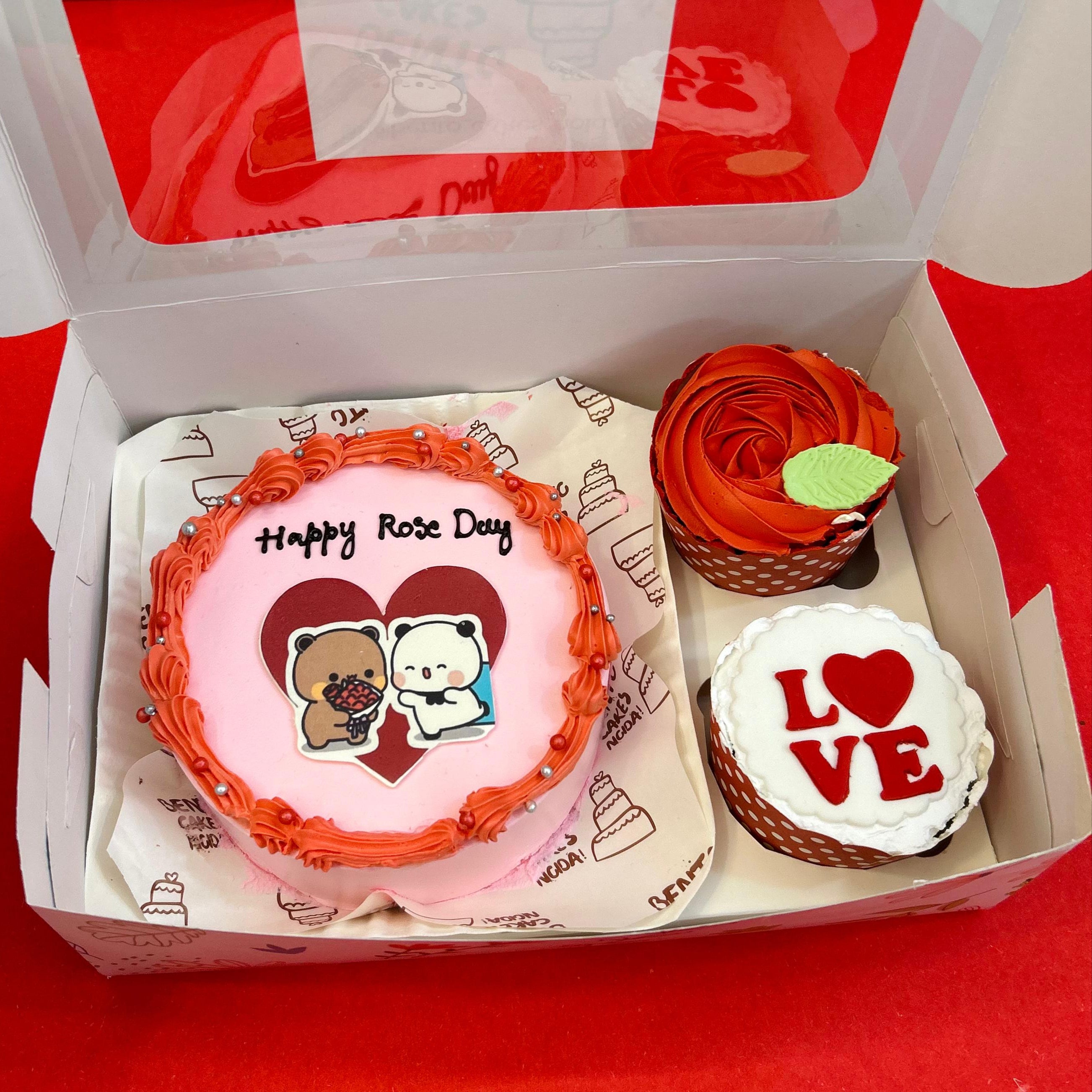 A box filled with colorful cupcakes alongside a mini bento combo cake for Hug Day celebration.