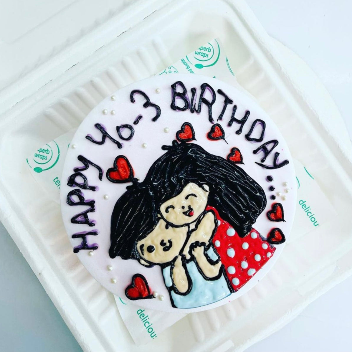 A charming birthday cake showcasing a couple hugging, representing affection and the spirit of celebration.