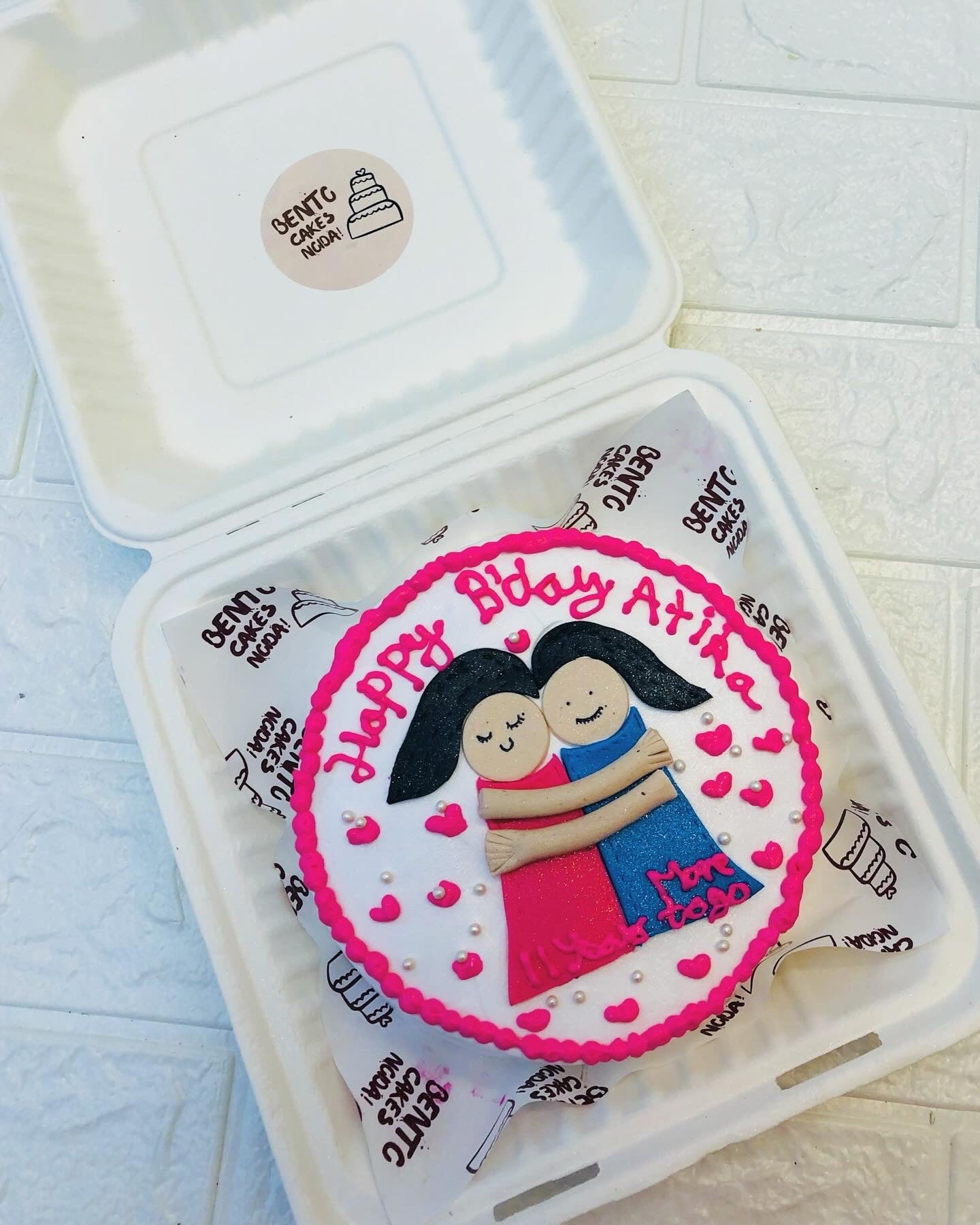 Two friends hugging each other on her birthday.