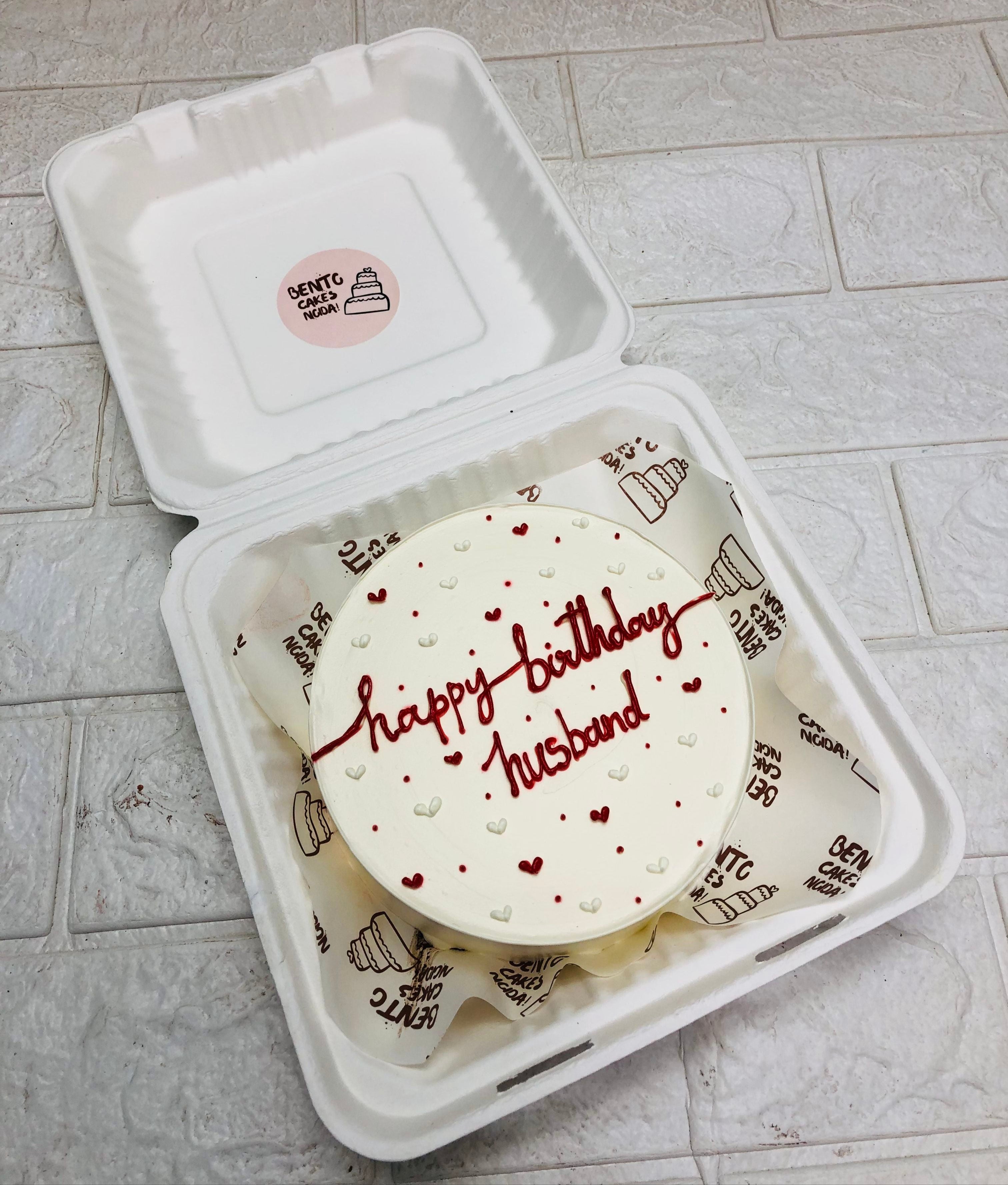 A white bento cake with red and white hearts design for husband's birthday.