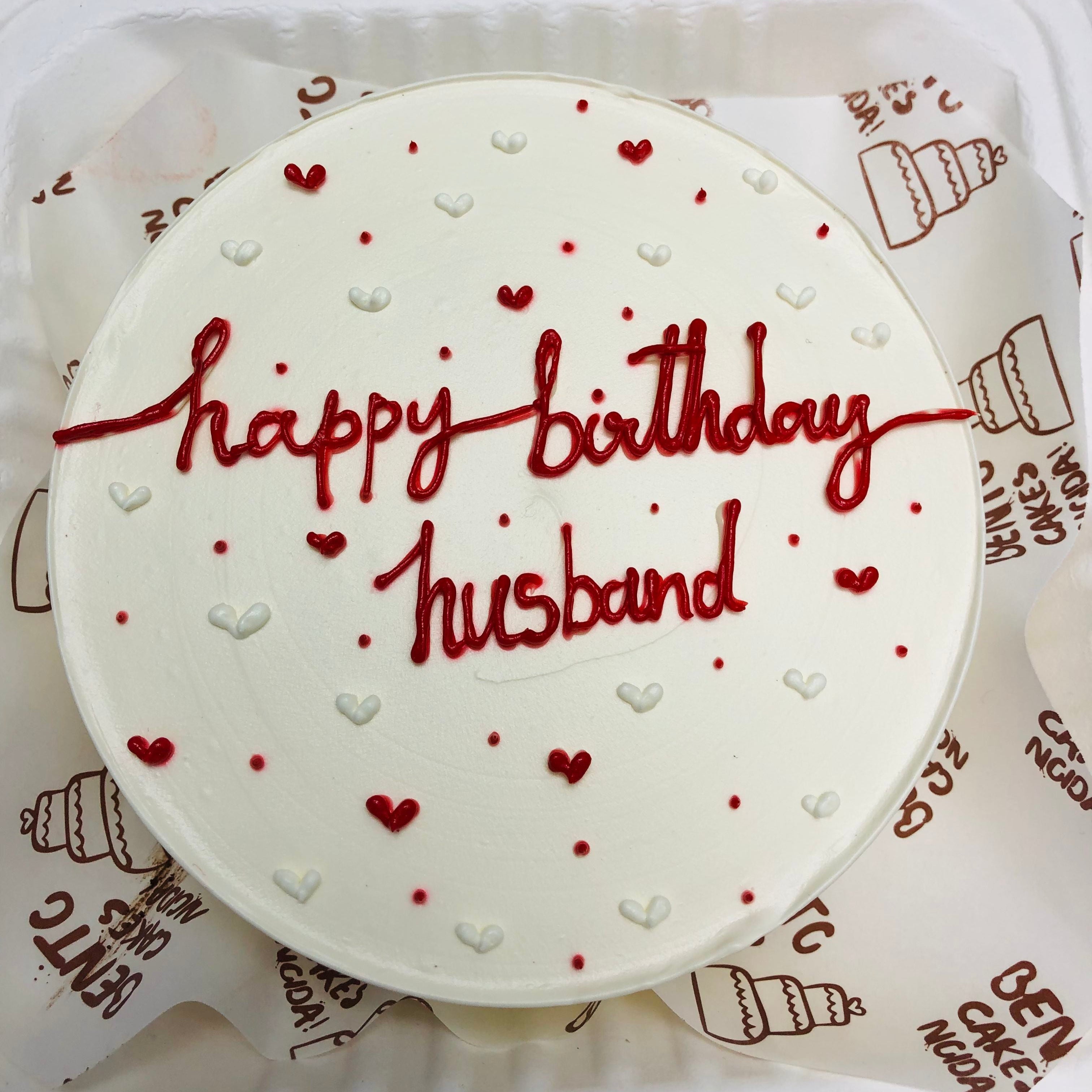 A white bento cake with red and white hearts design for husband's birthday.