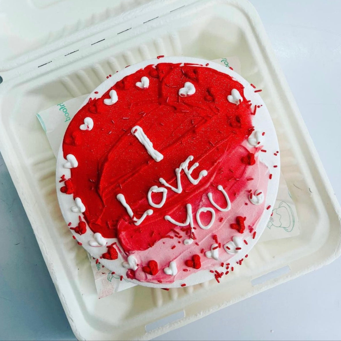 A scrumptious cake nestled in a bento box, ideal for sharing or celebrating a special moment.