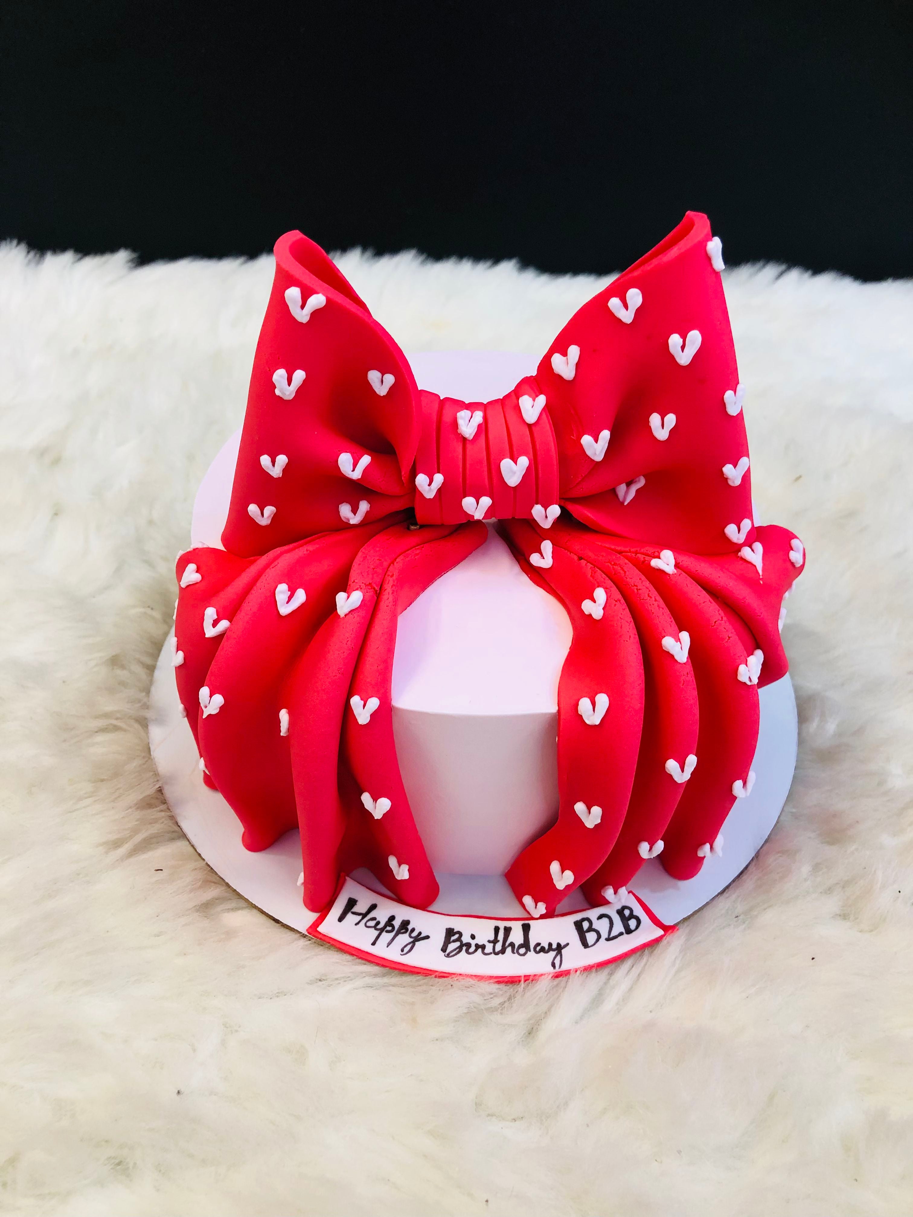 White Base with Red Bow Birthday Cake
