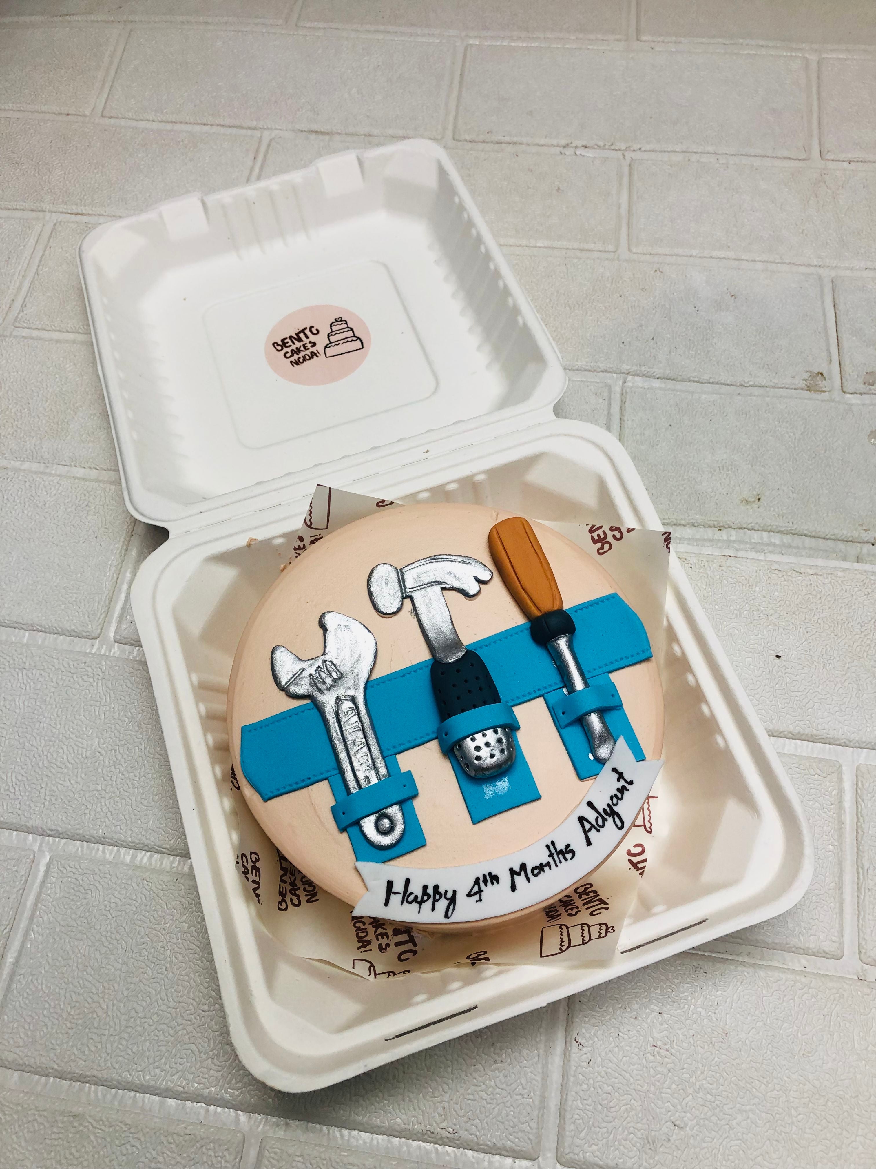 4‑Month Tool Belt Bento Cake