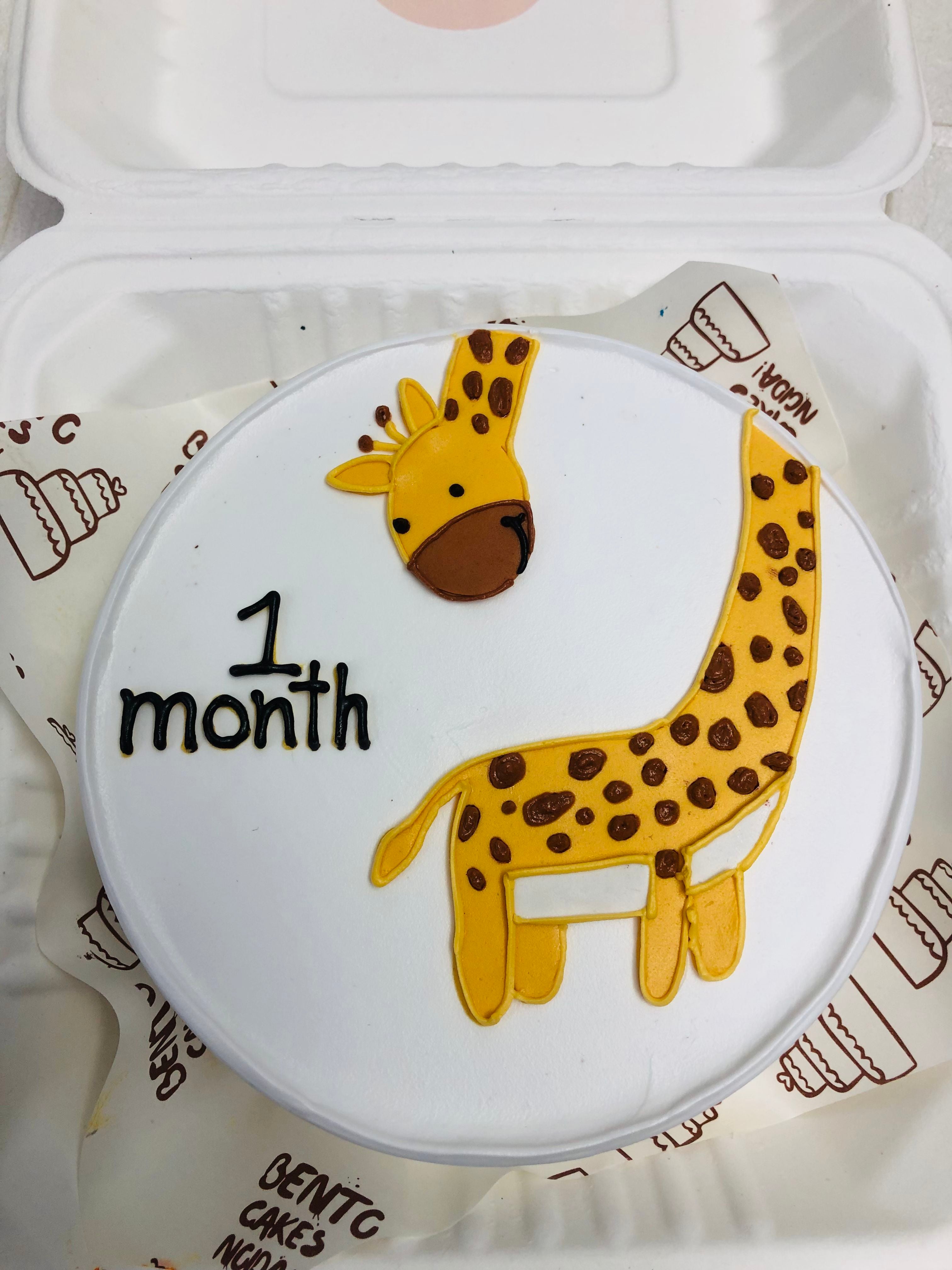Giraffe theme milestone cake