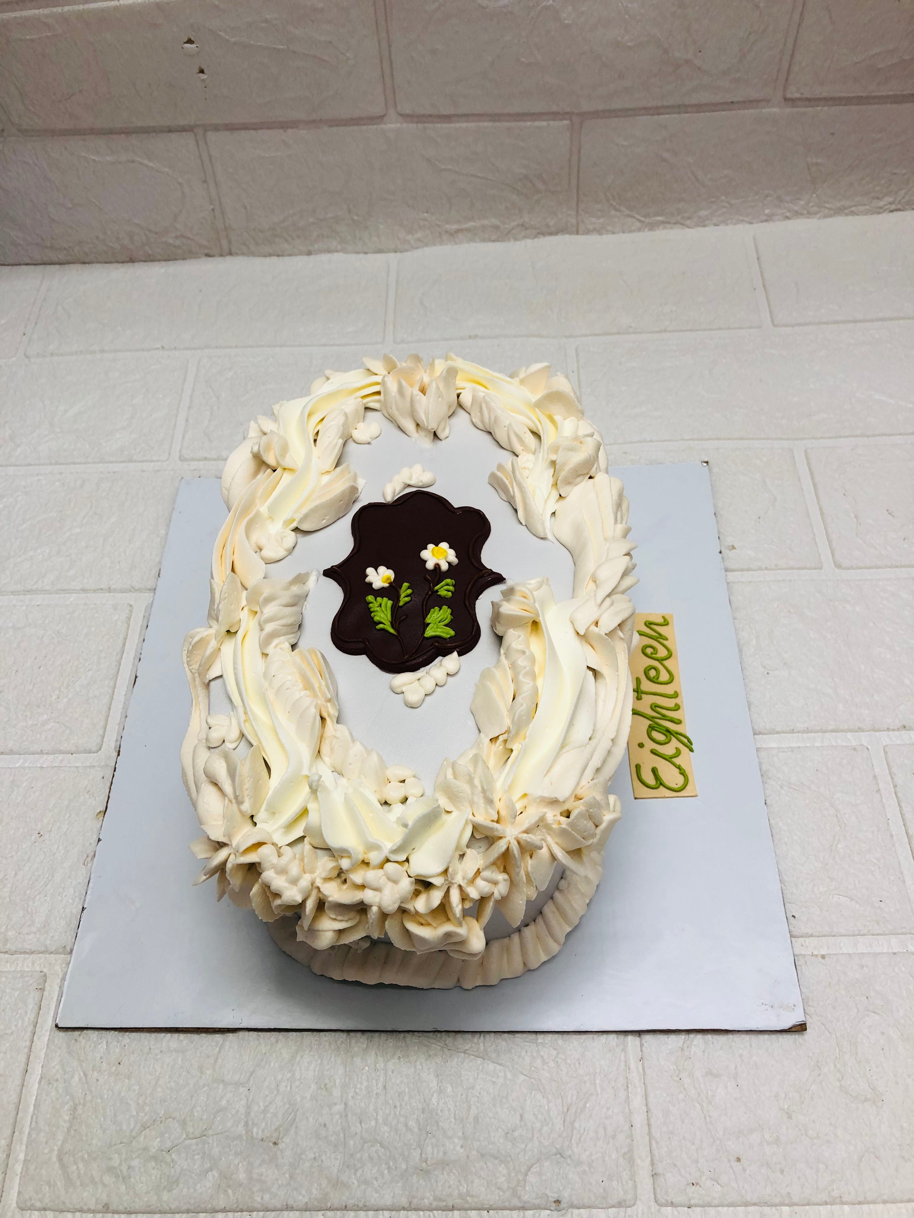 Oval White with Floral Swirls cake