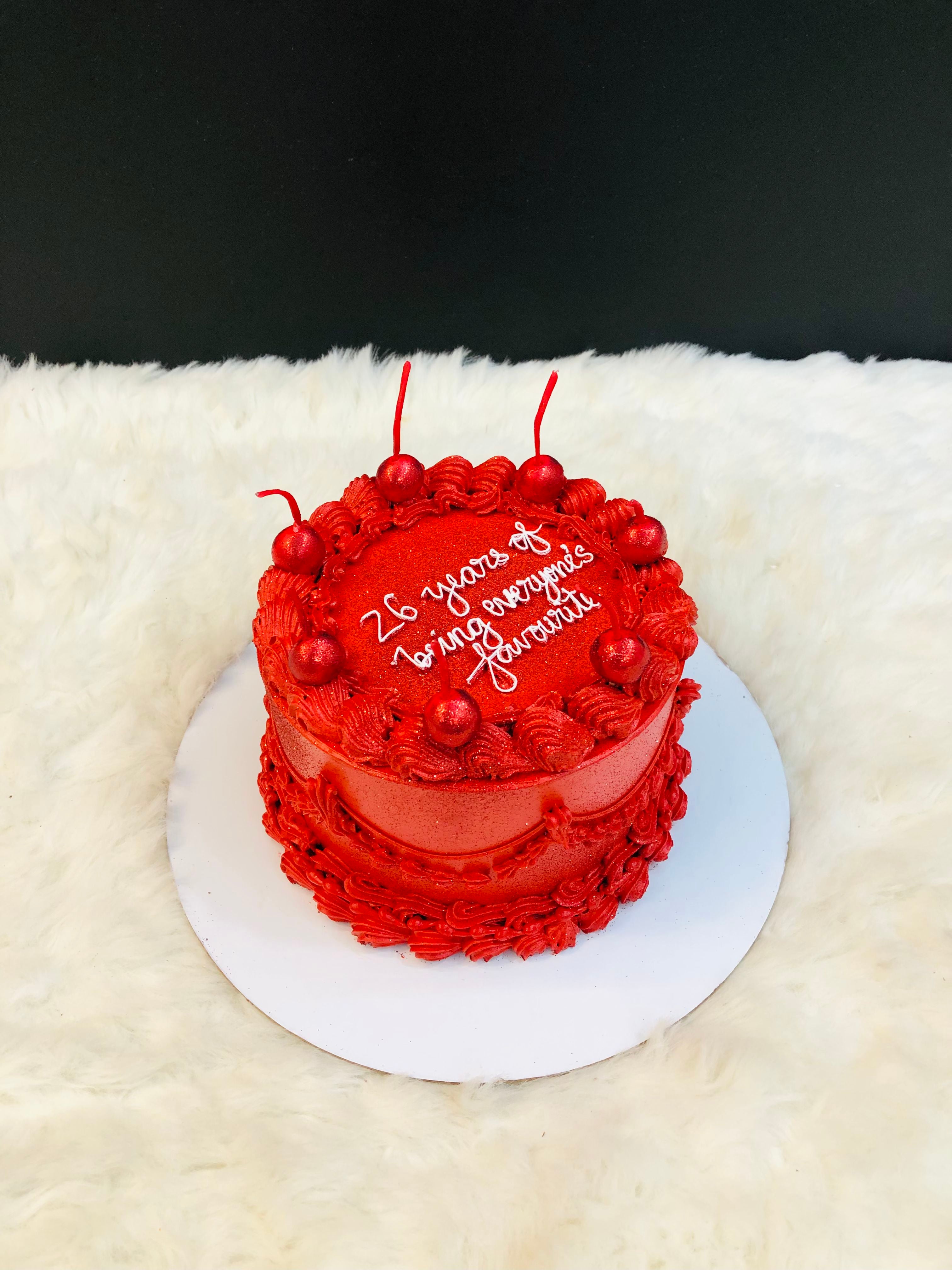 Red Frosted with Cherries cake