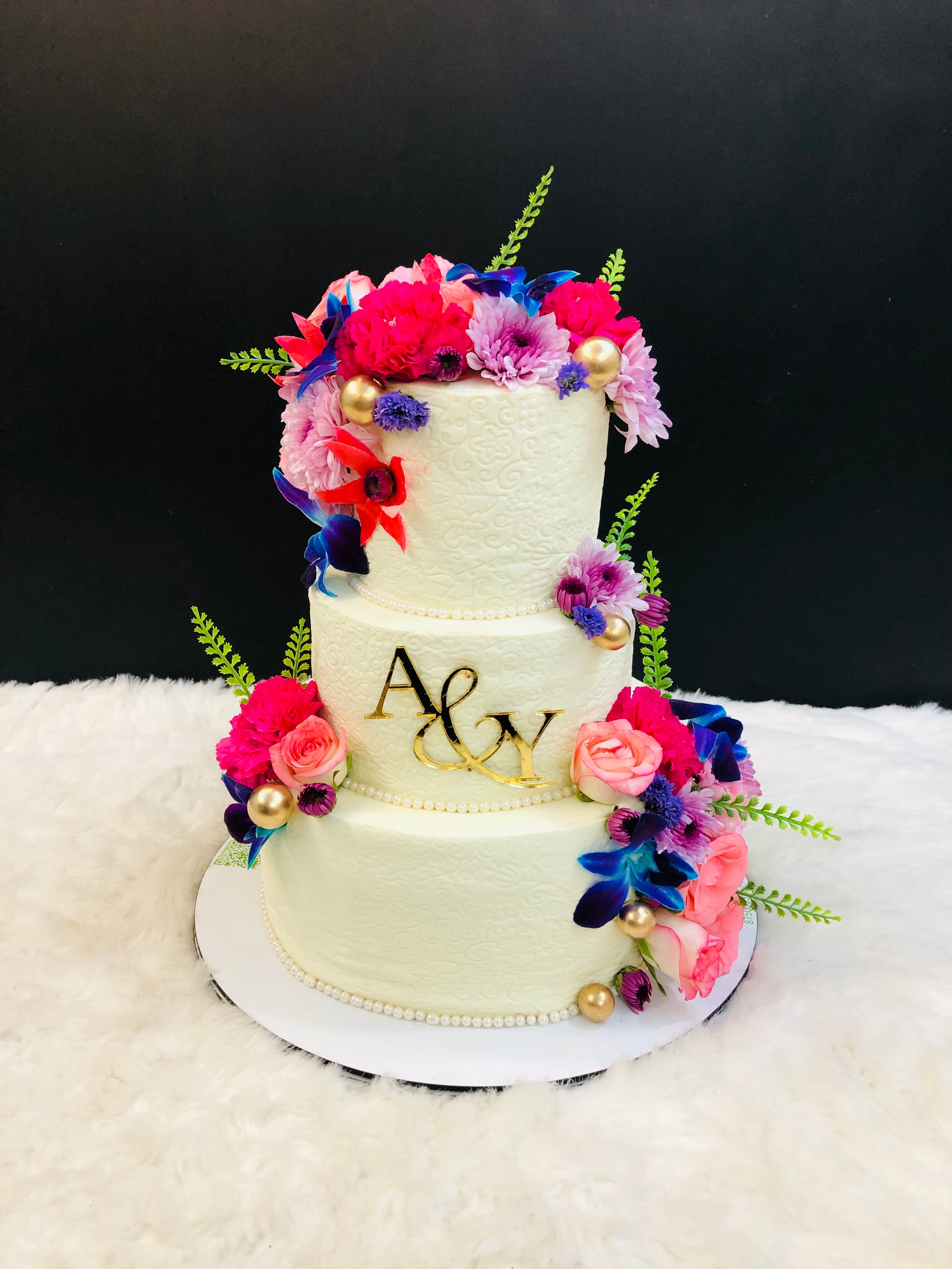 Three-Tier White with Swirl Design cake