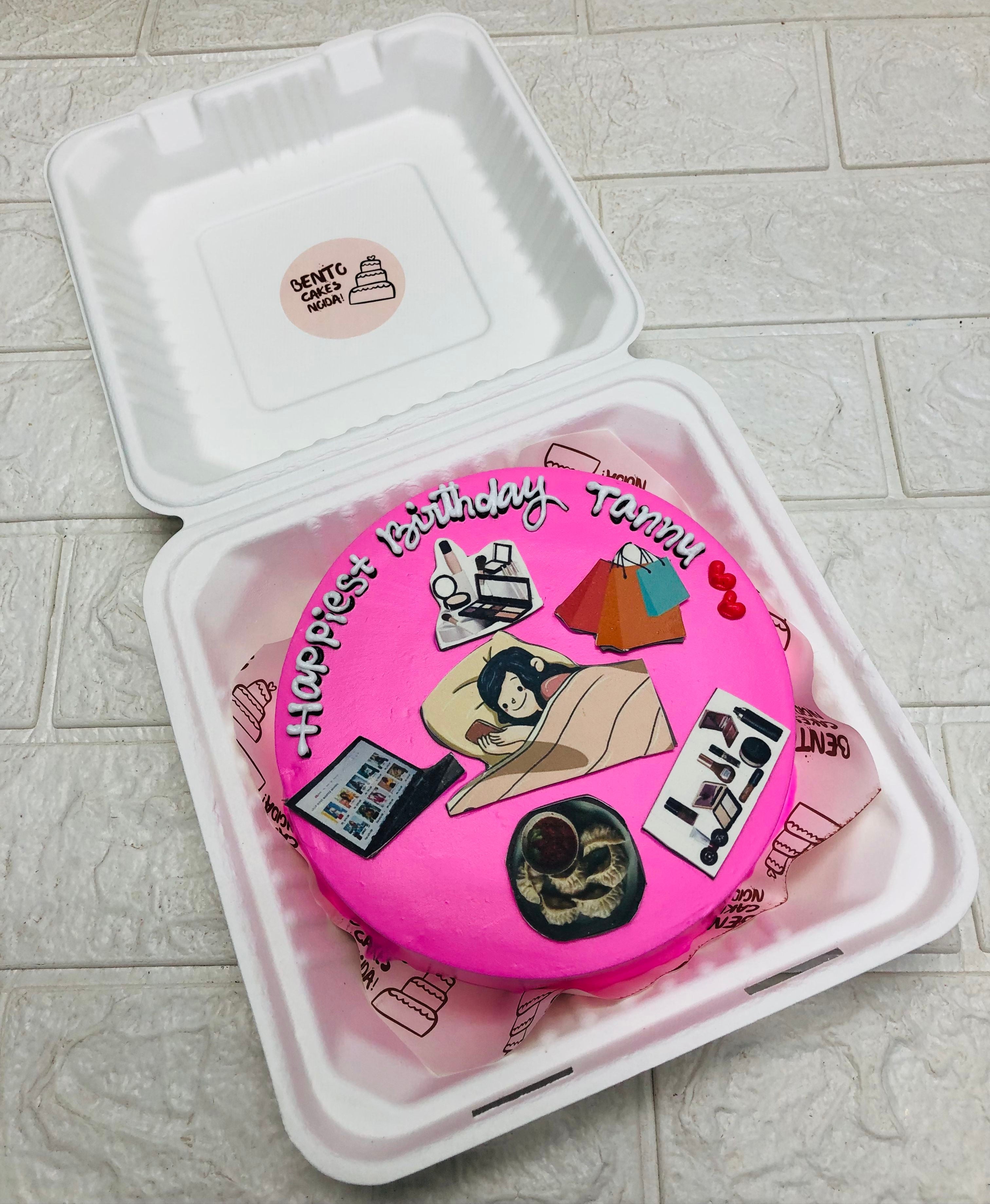 A lazy, make lover, shopaholic, foody, workaholic girl sleeping on pink cake.