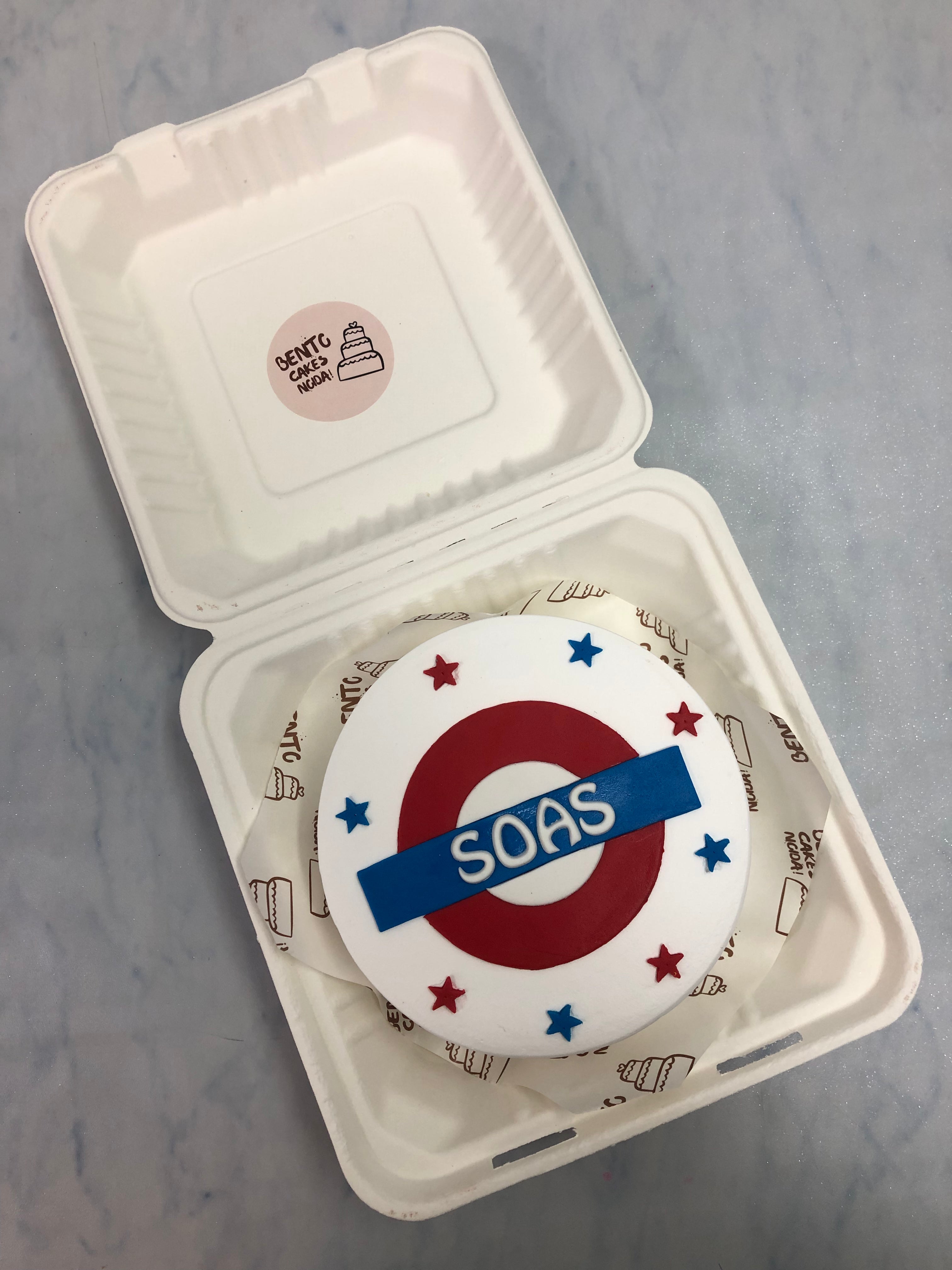 A white banto cake desgned on the theme of London Underground Pass.
