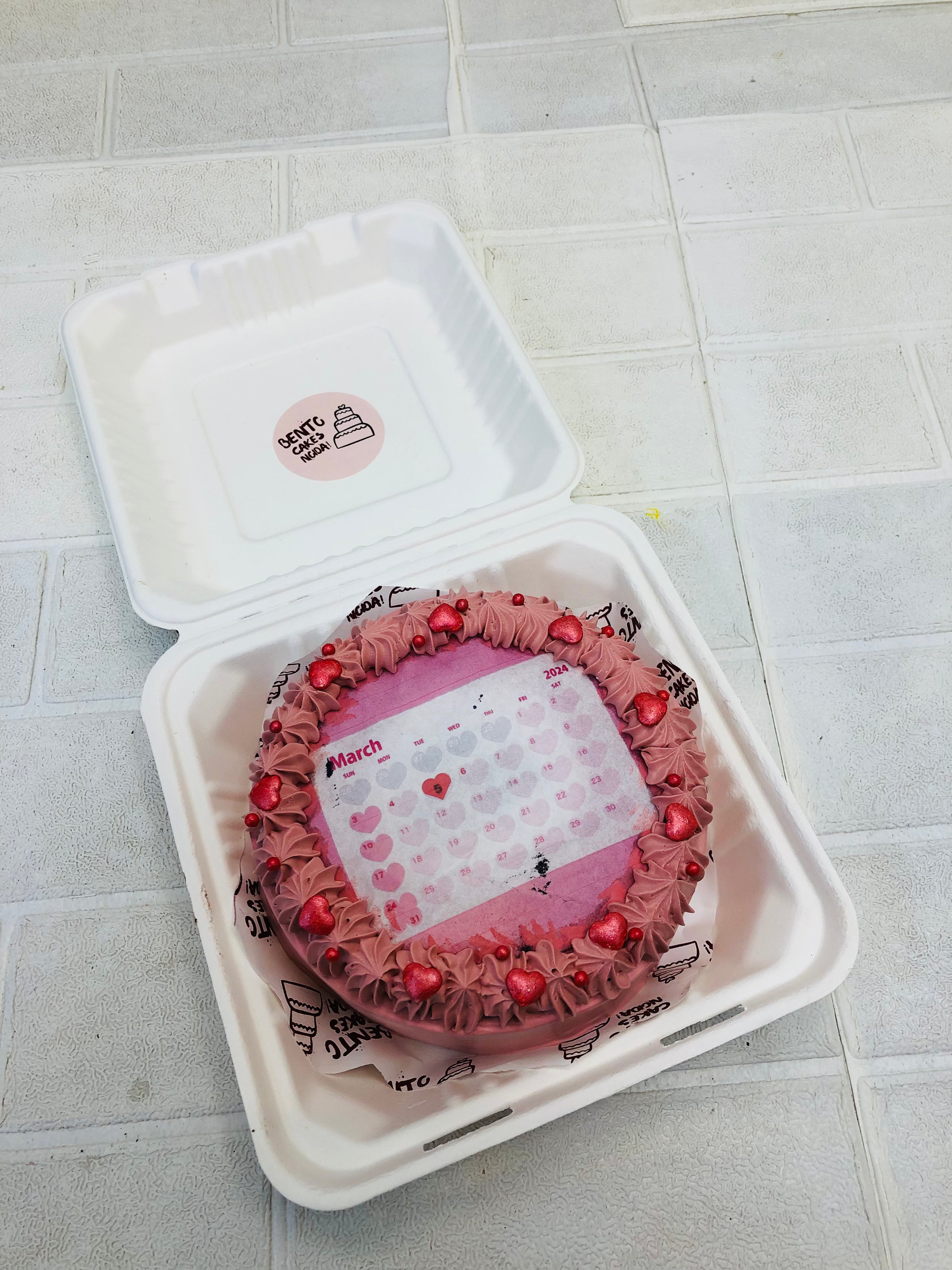 A magenta color fire bento cake with fire calendar theme.