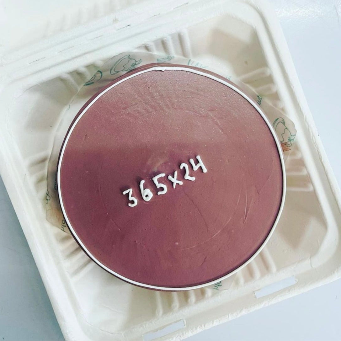 A vibrant pink plate showcasing the number "365*24" in a stylish font.