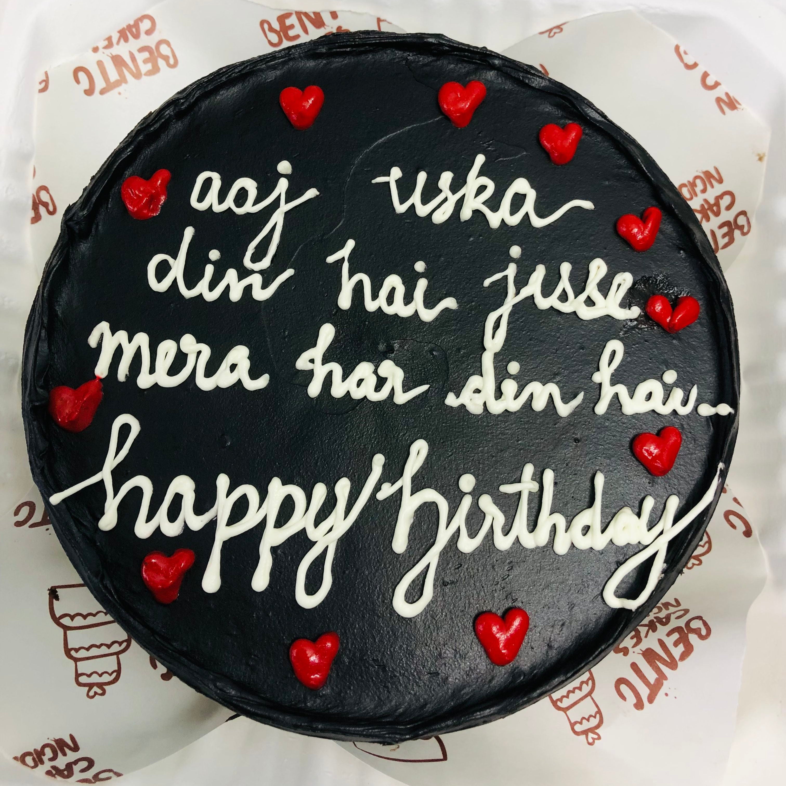A colorful birthday cake adorned with the words "Happy Birthday" and little message beautifully written in Hindi with front view.