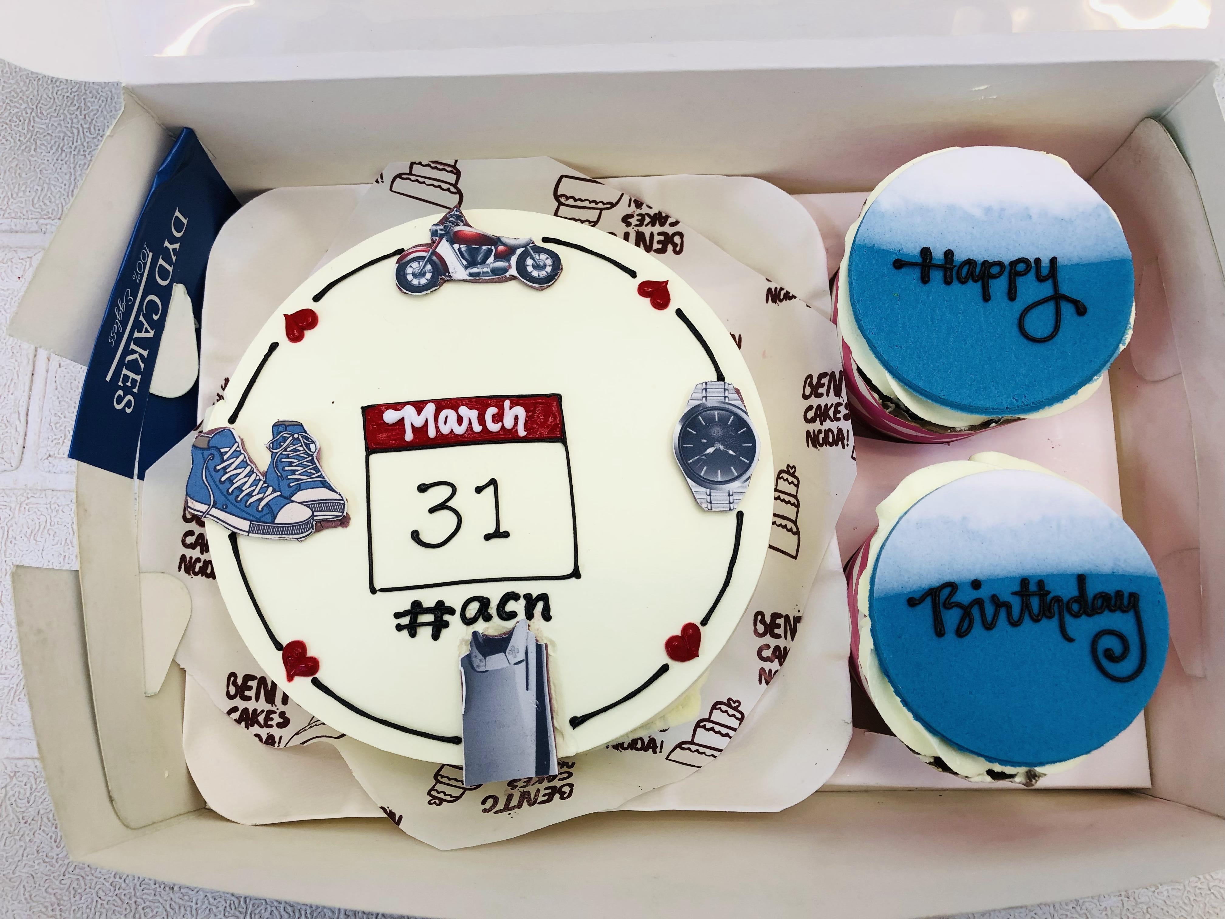 A Men's Theme Mini Bento Combo Cake set featuring a large white-frosted cake decorated with elements such as a sneaker, a motorcycle, a wristwatch, and a trash can. It includes two smaller cakes with blue and white frosting, displaying the messages "Happy" and "Birthday." The set is neatly packaged in a white box with decorative paper printed with "GENETI