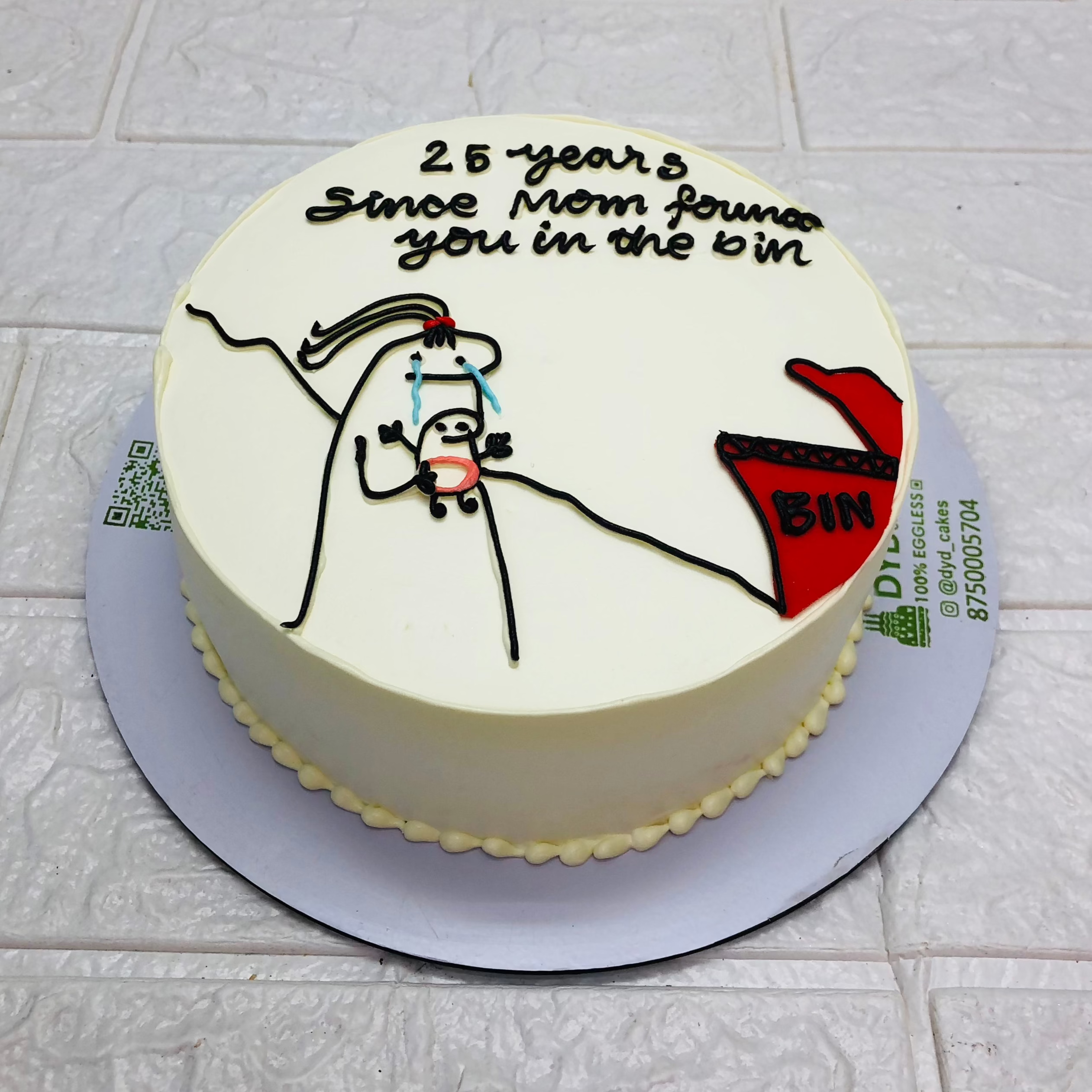 An off white cake destined with a mimi and a baby mimi cartoon character on its top and the theme designed for birthday occasions.