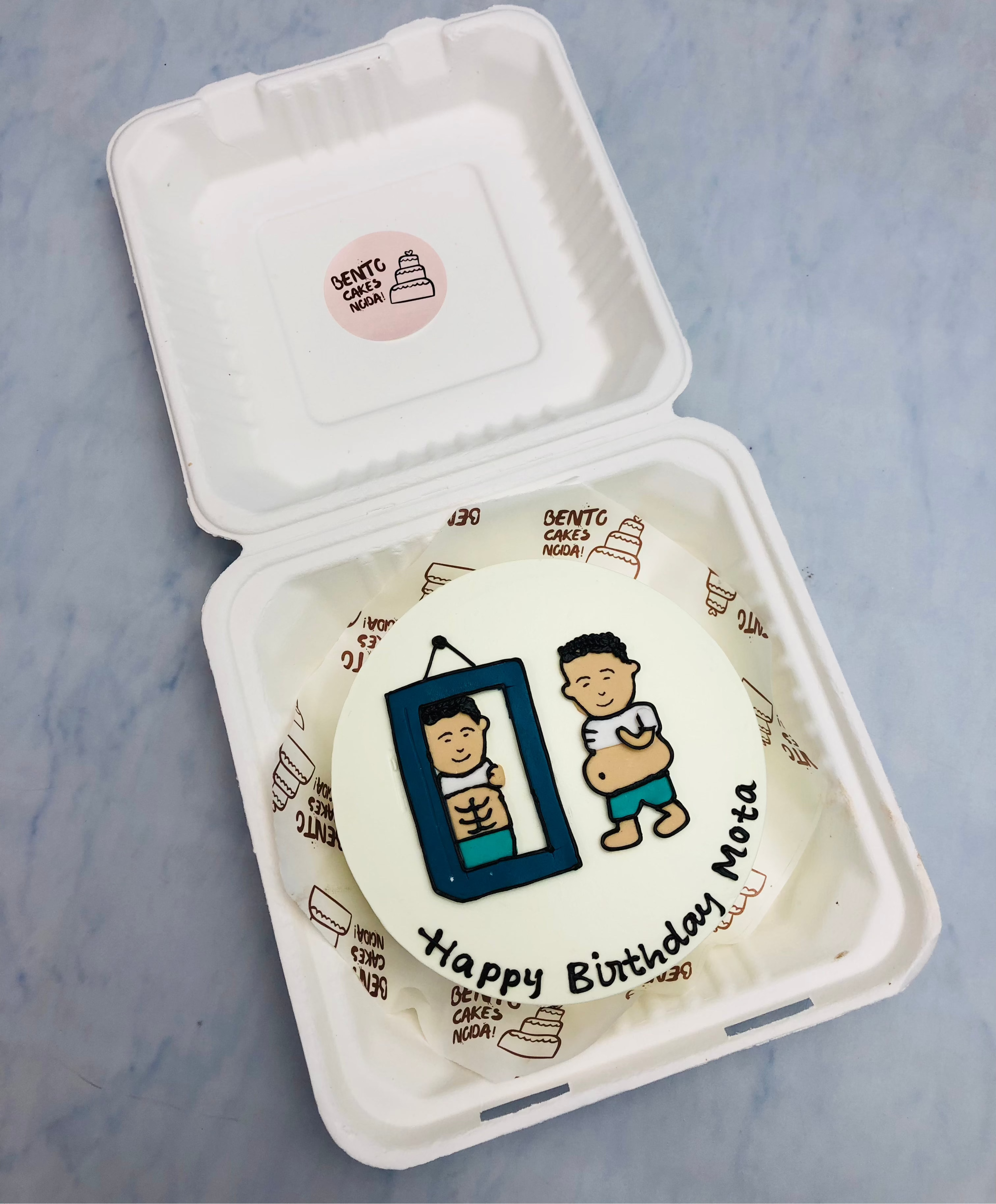 A white bento cake designed with a man looking his body in the mirror.