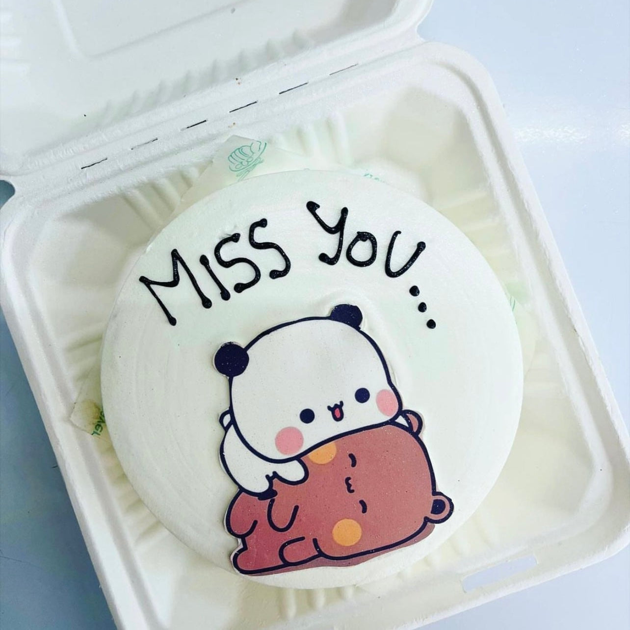 A white bento cake with sleeping bubu dudu cartoon print.