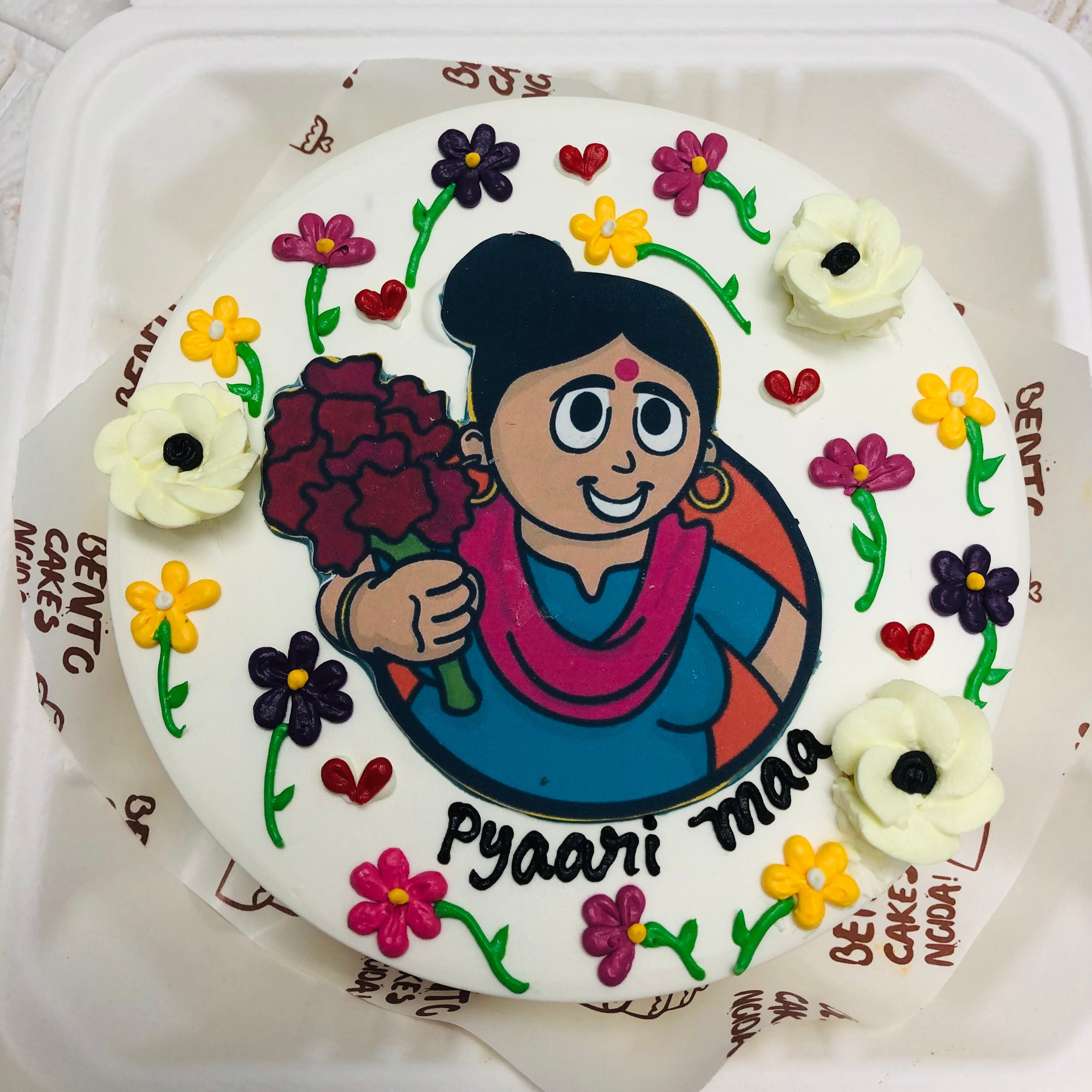 A colorful cake featuring a cheerful cartoon mother on top, perfect for mothers birthday celebration, showing top view.