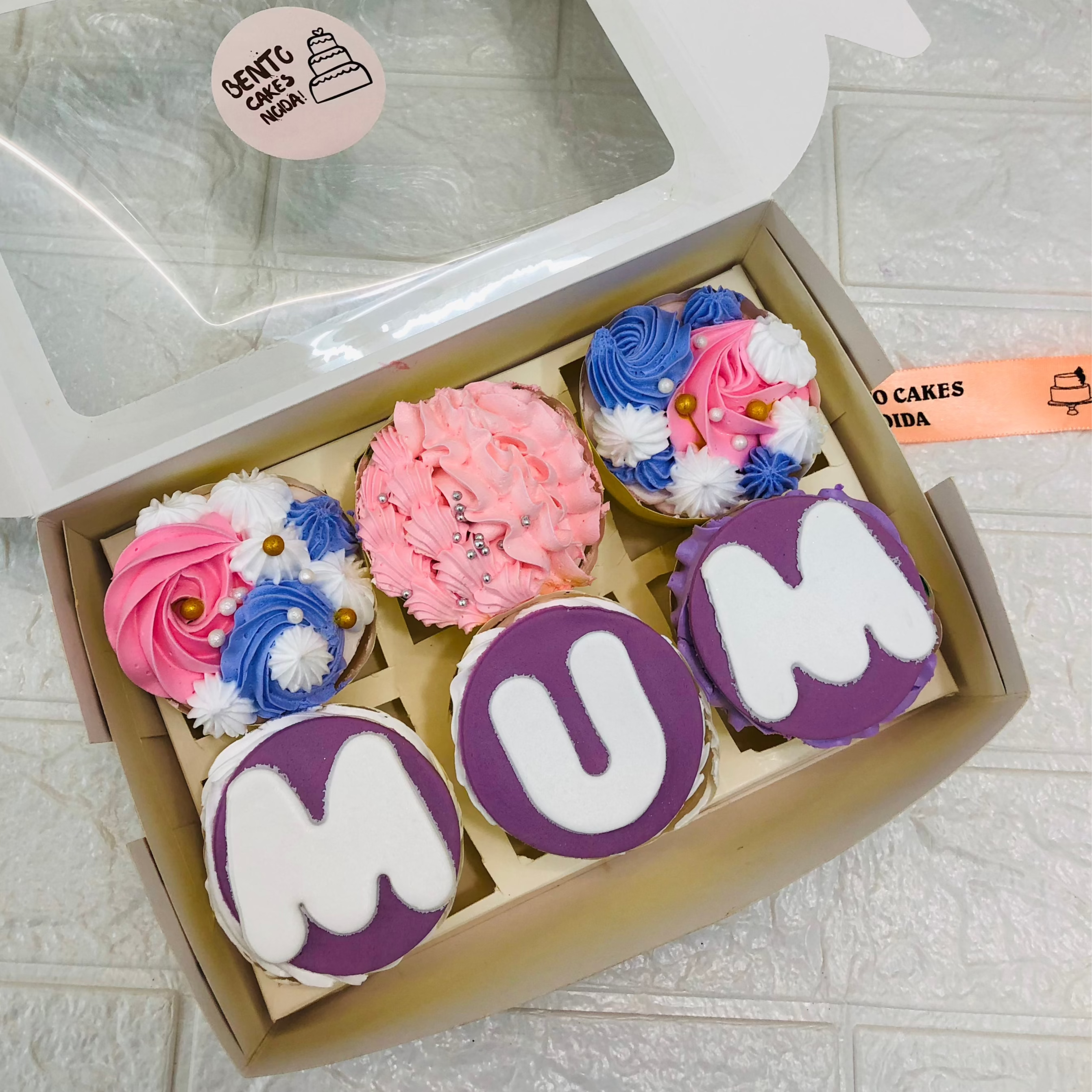 A bocx containing 6 cupcake set having different texts and designs on it, this is specially designed for Mothers Day Occasion.