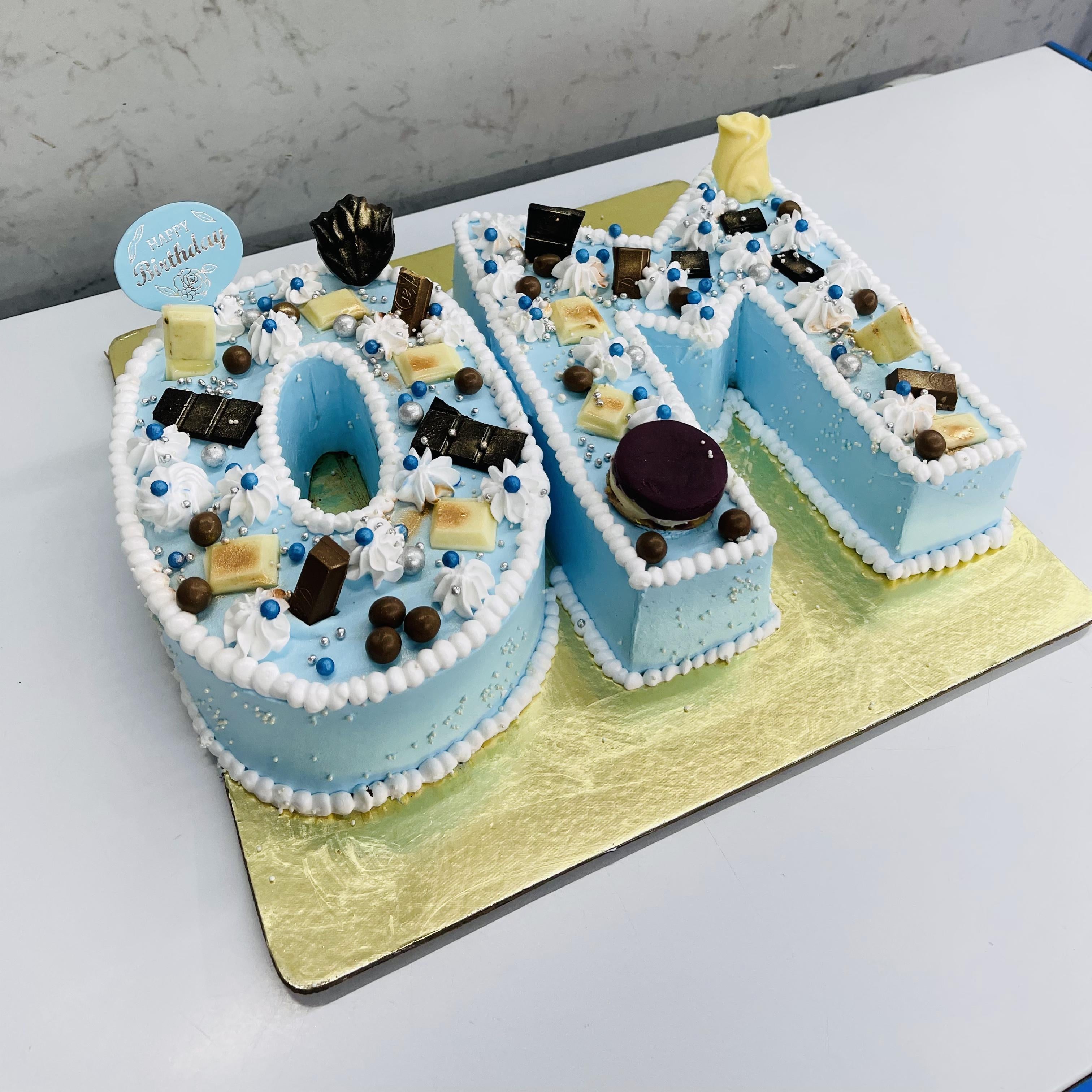 Customize alphabet designer cake is mainly for birthday celebrations and is beautifully decorated with chocolates.