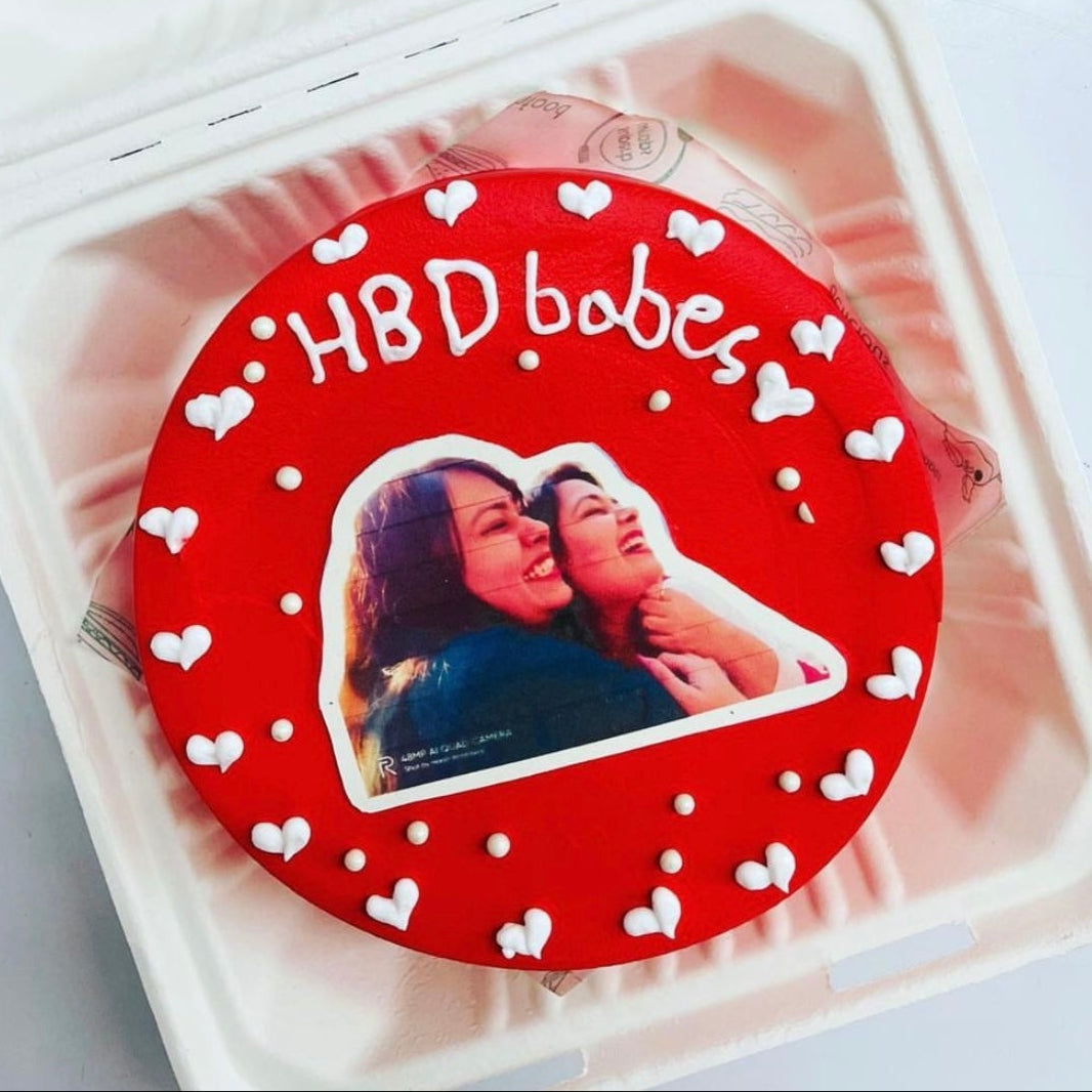 A delightful white heart designs adorned with a woman's image and a heart, symbolizing love and sweetness.