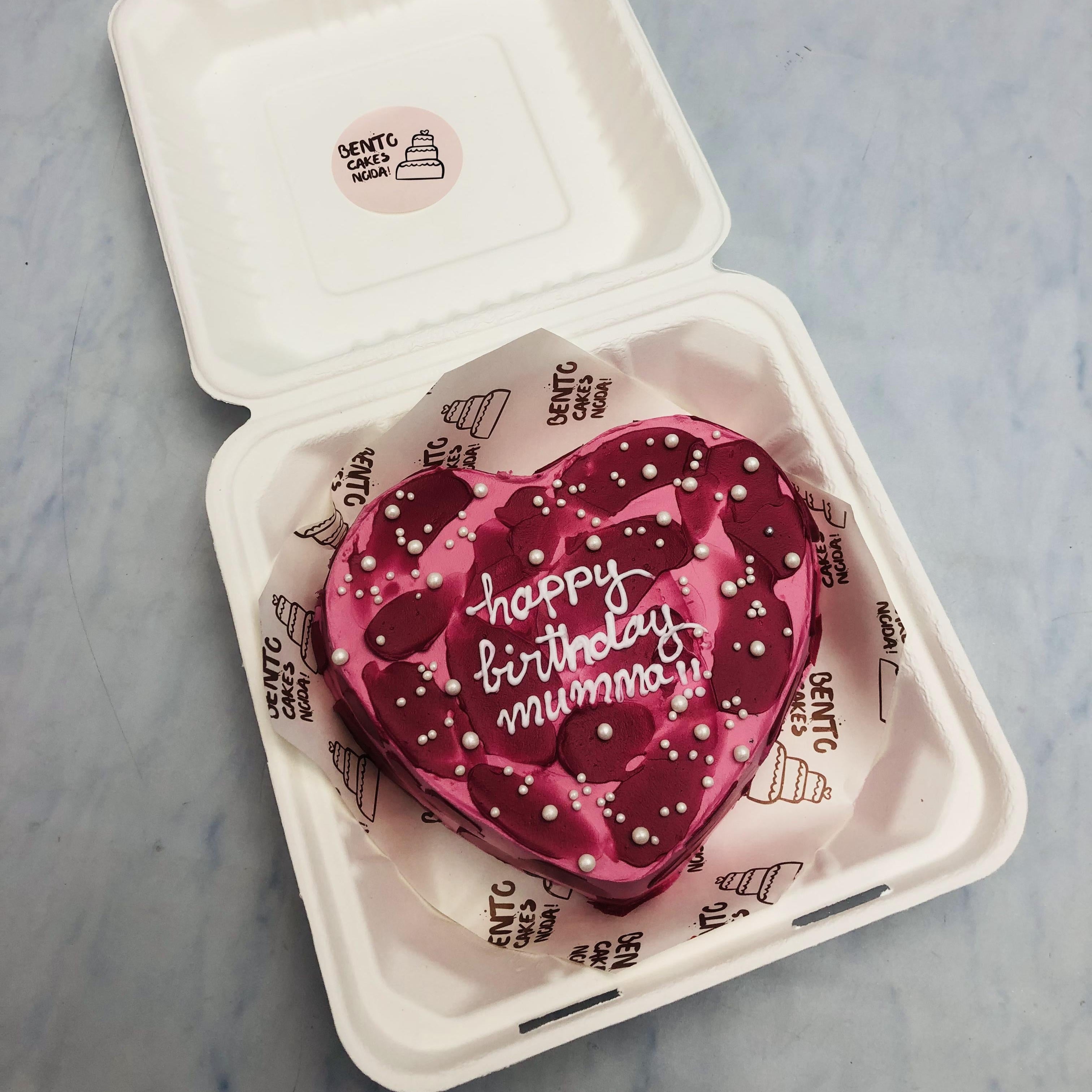 A Pink Magenta Heart Shape Bento Cake with white text.