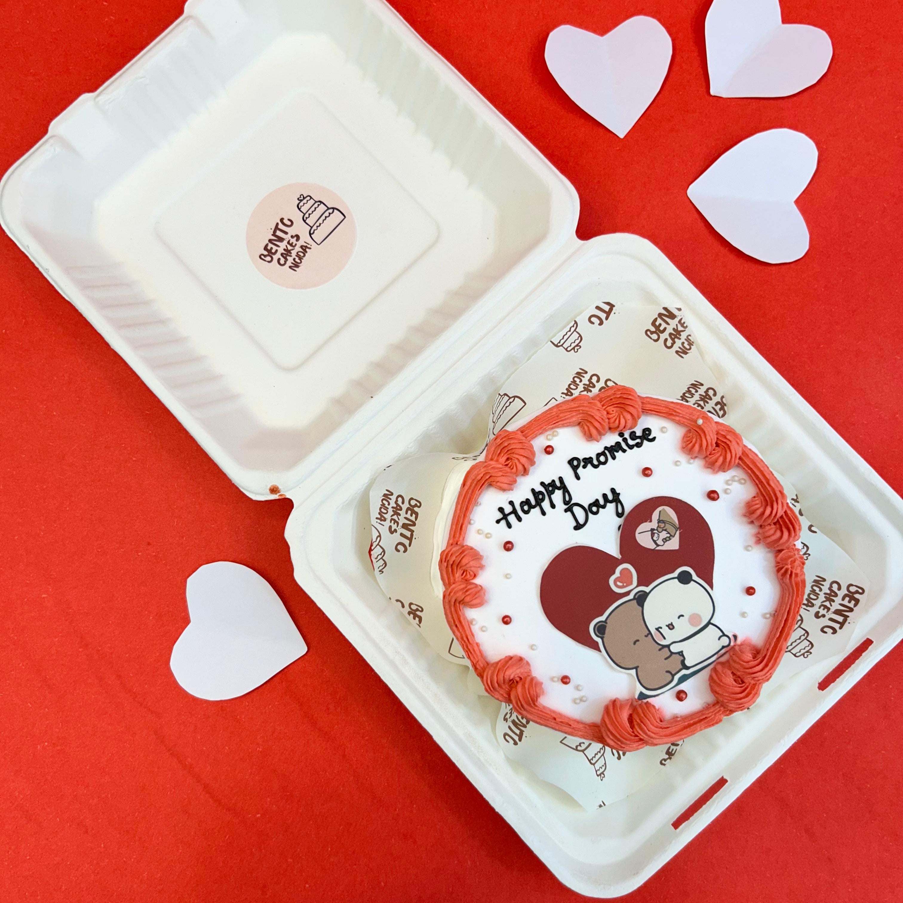 Promise Day cake with a round design in a bento box, accompanied by the Bubu Dudu cartoon character.