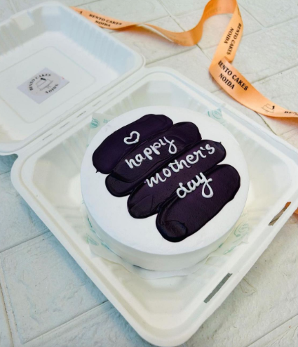 A purple shades on white cake designed for mothers day occasion.