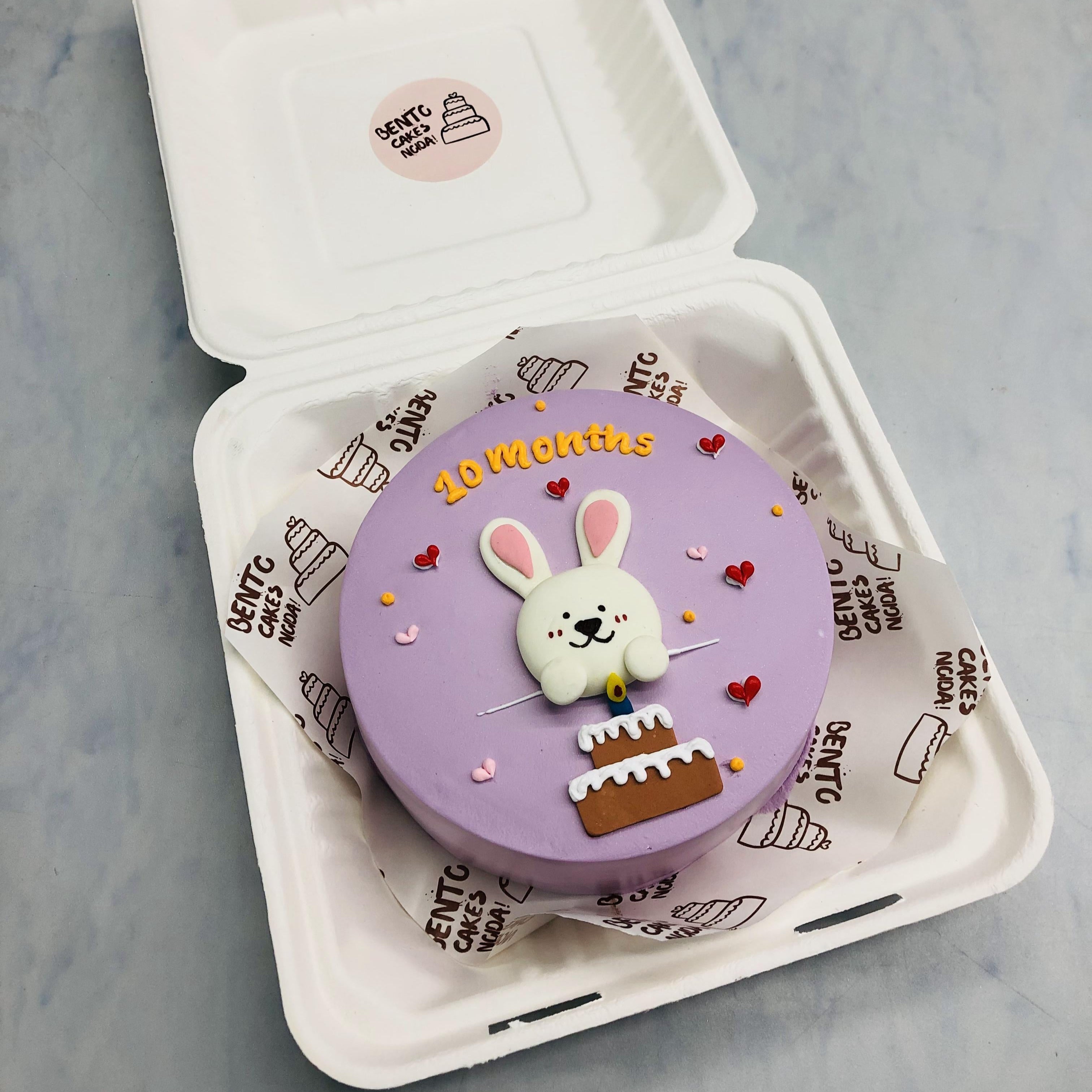 A light purple bento cake with cute rabbit celebrating birthday.