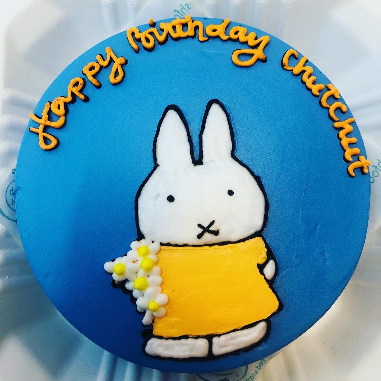 A beautifully crafted cake showcasing a playful bunny on its surface, suitable for various celebrations.