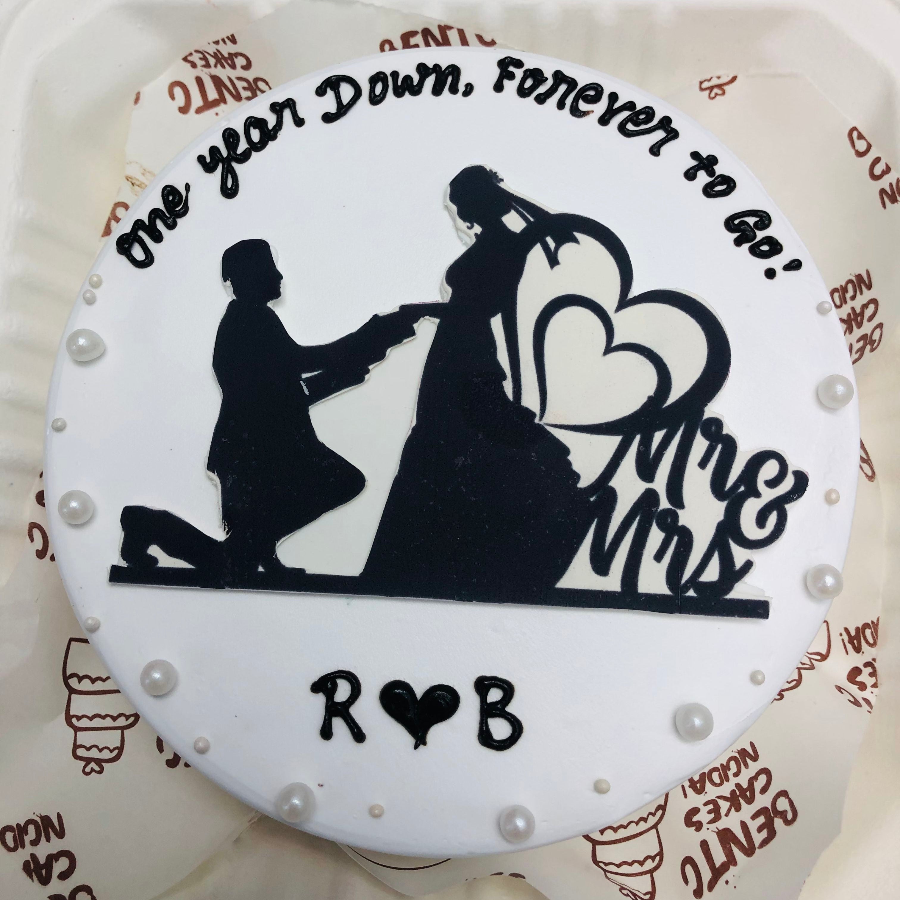 A charming cake adorned with a couple's silhouette, representing romance and special moments.