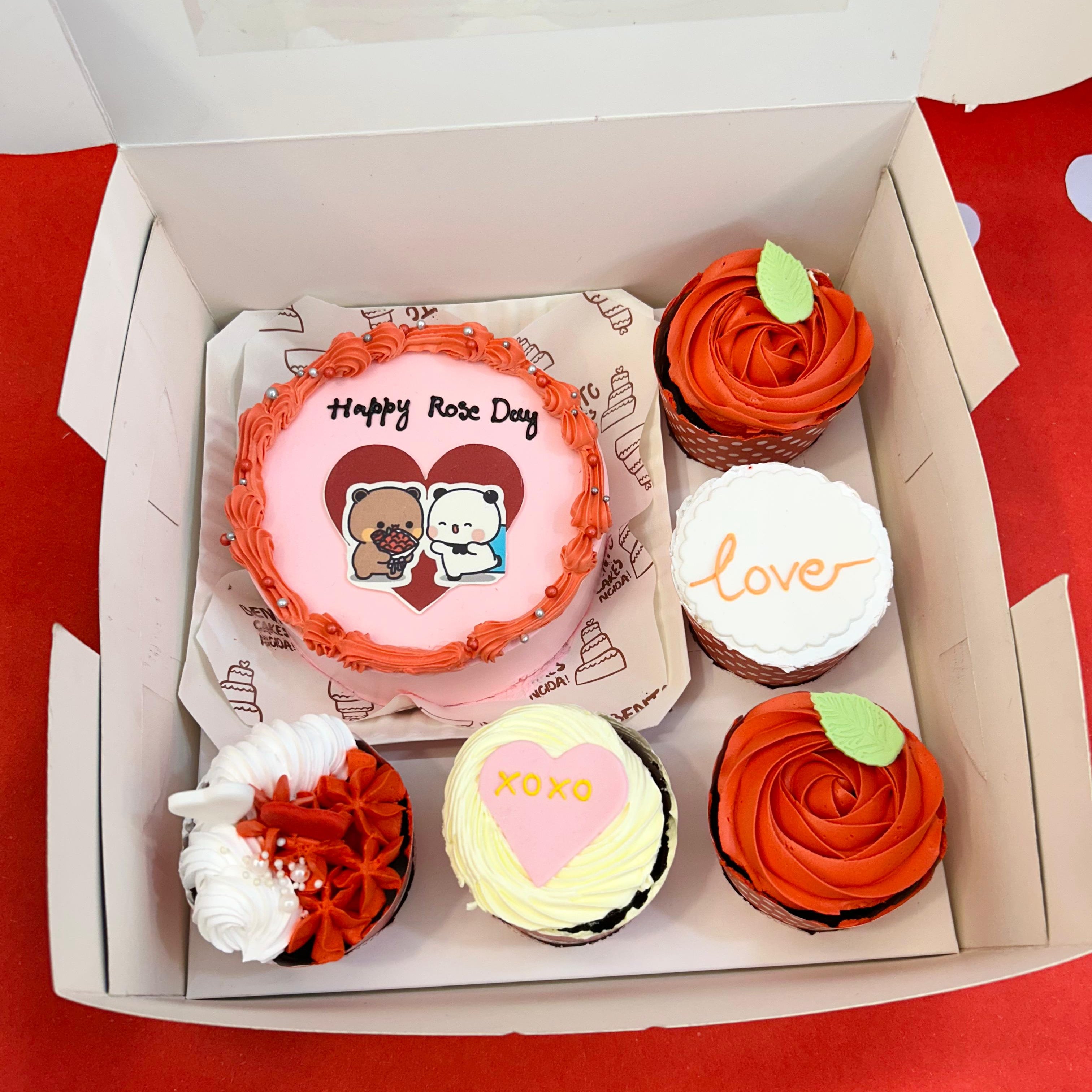 A delightful display of a boxe filled with 5 colorful cupcakes with a cake, featuring a bubu dudu bento combo cake among them.