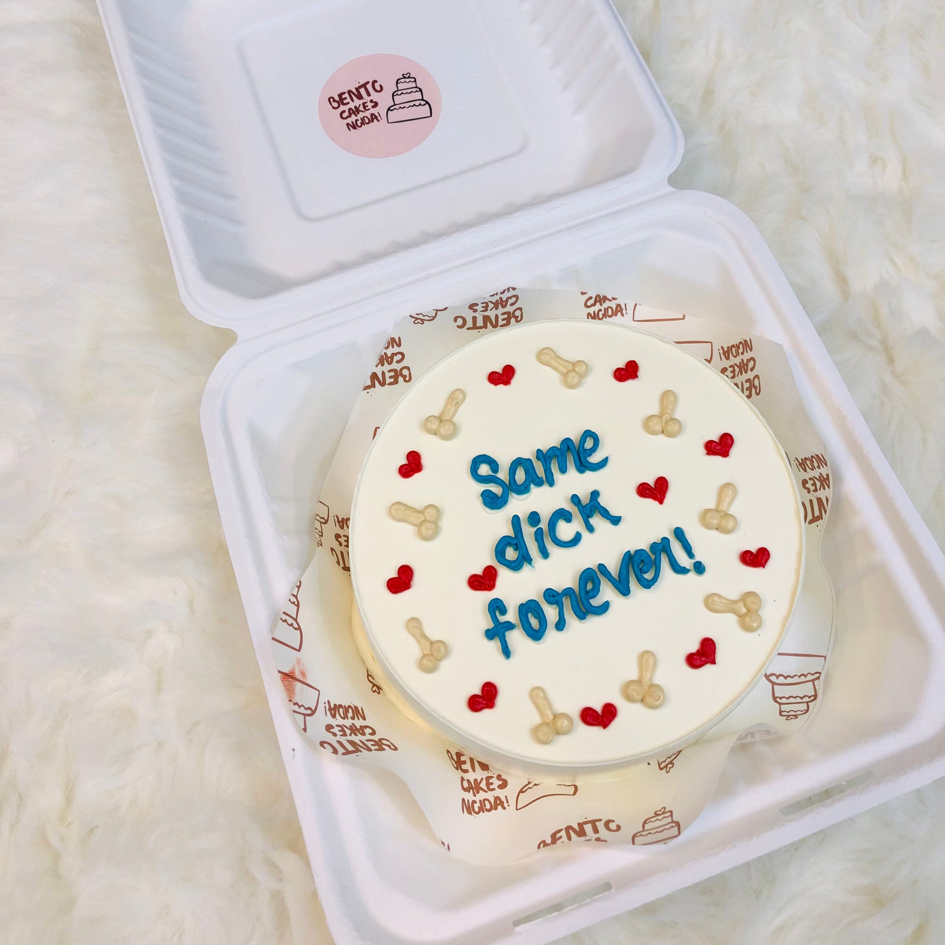 A cake designed with men's gentiles design and red hearts and a text "Same dick forever" written with blue icing on it.