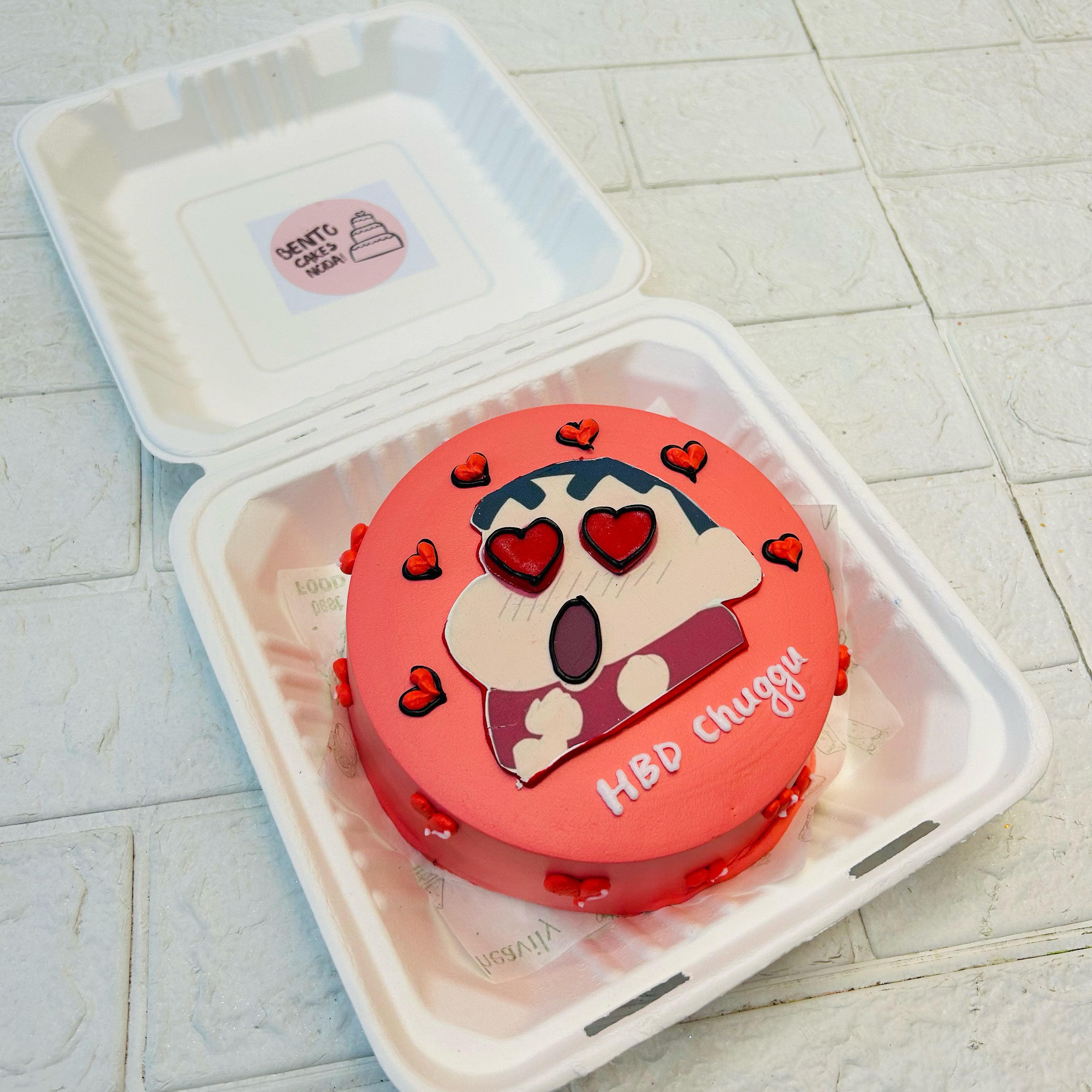 This Bento Cake is inspired from Shin Chan cartoon character and the sticker is beautifully placed on the top face of cake.