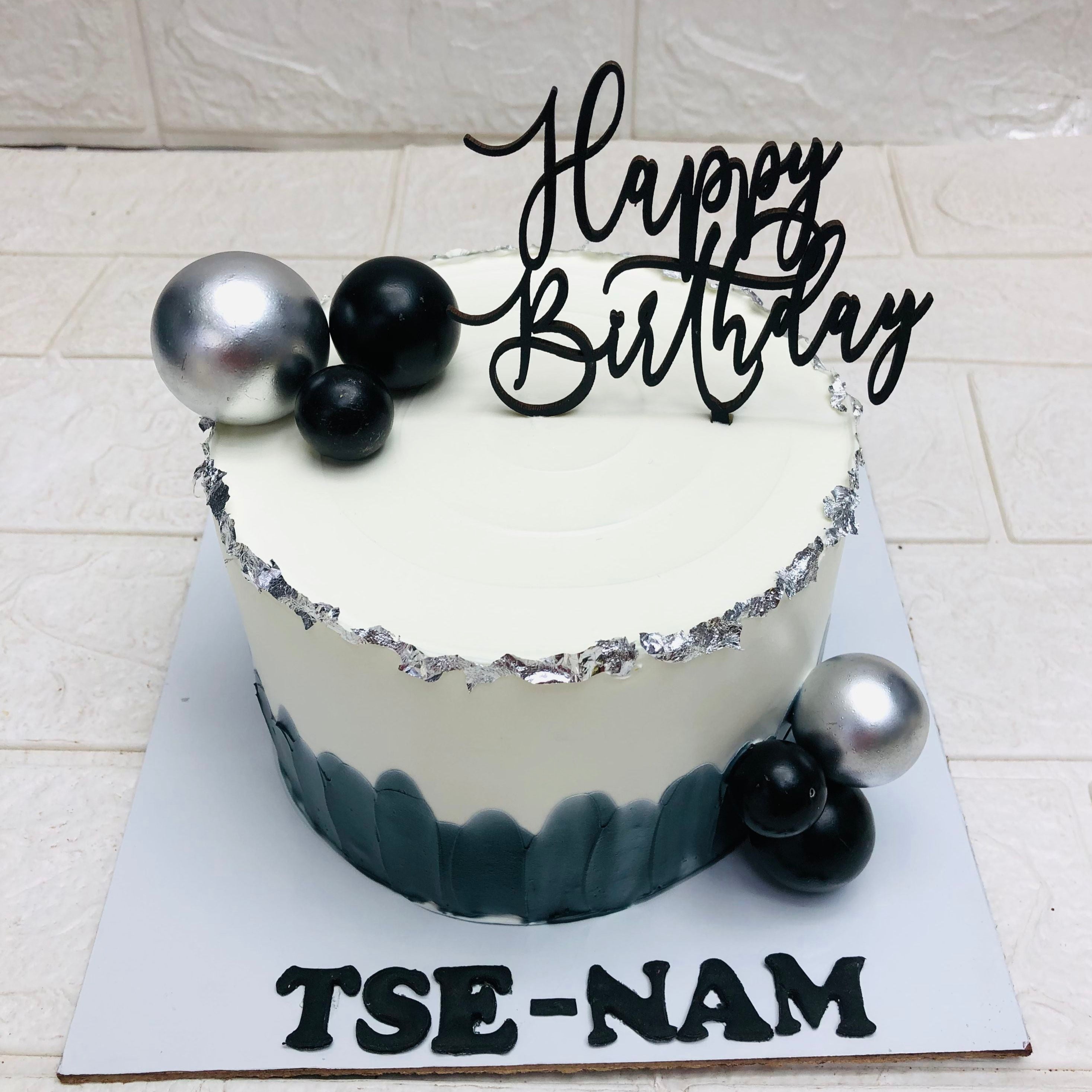 A birthday cake adorned with a cheerful "Happy Birthday" sign, celebrating a special occasion.