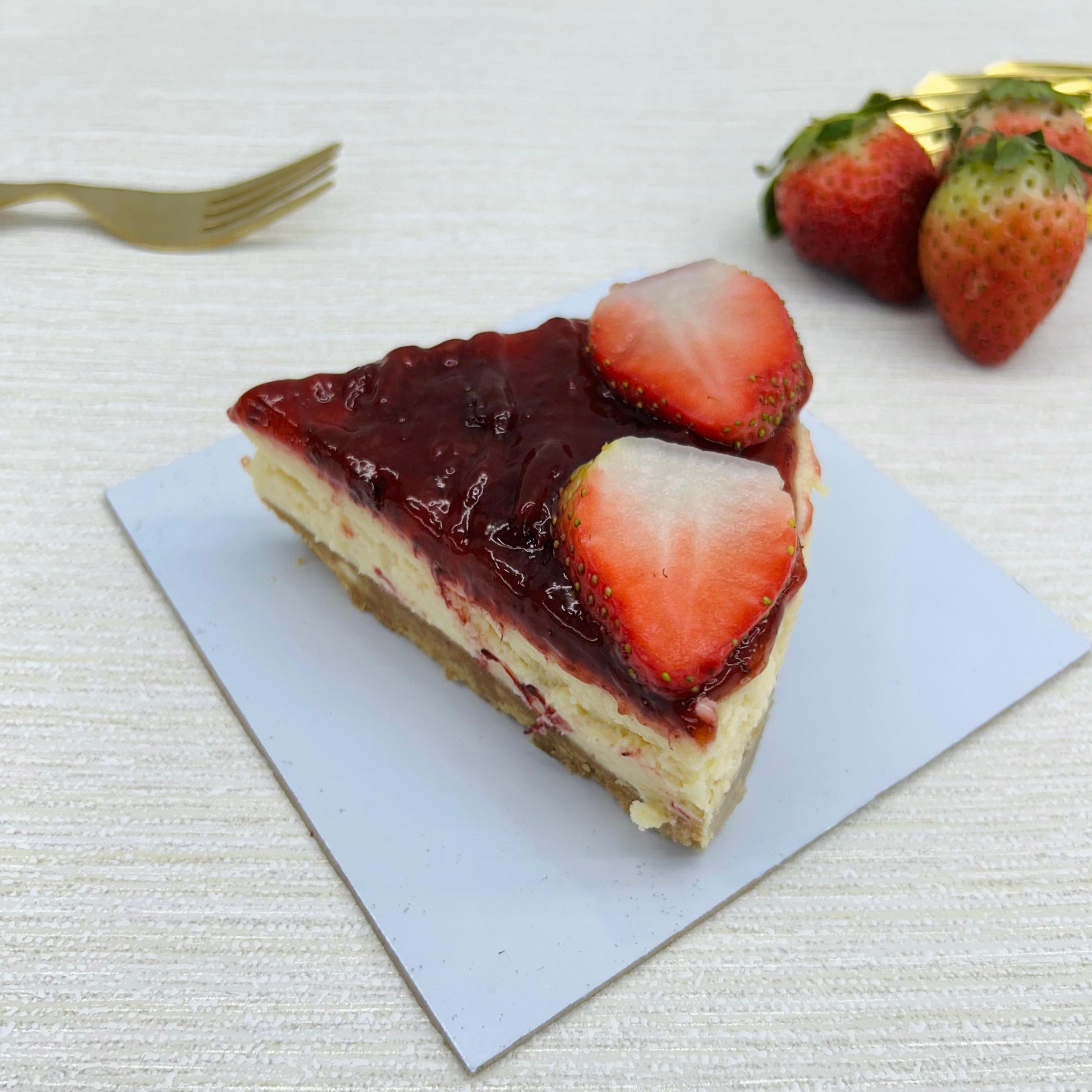 A Strawberry Cheesecake slice rich in fresh strawberry.