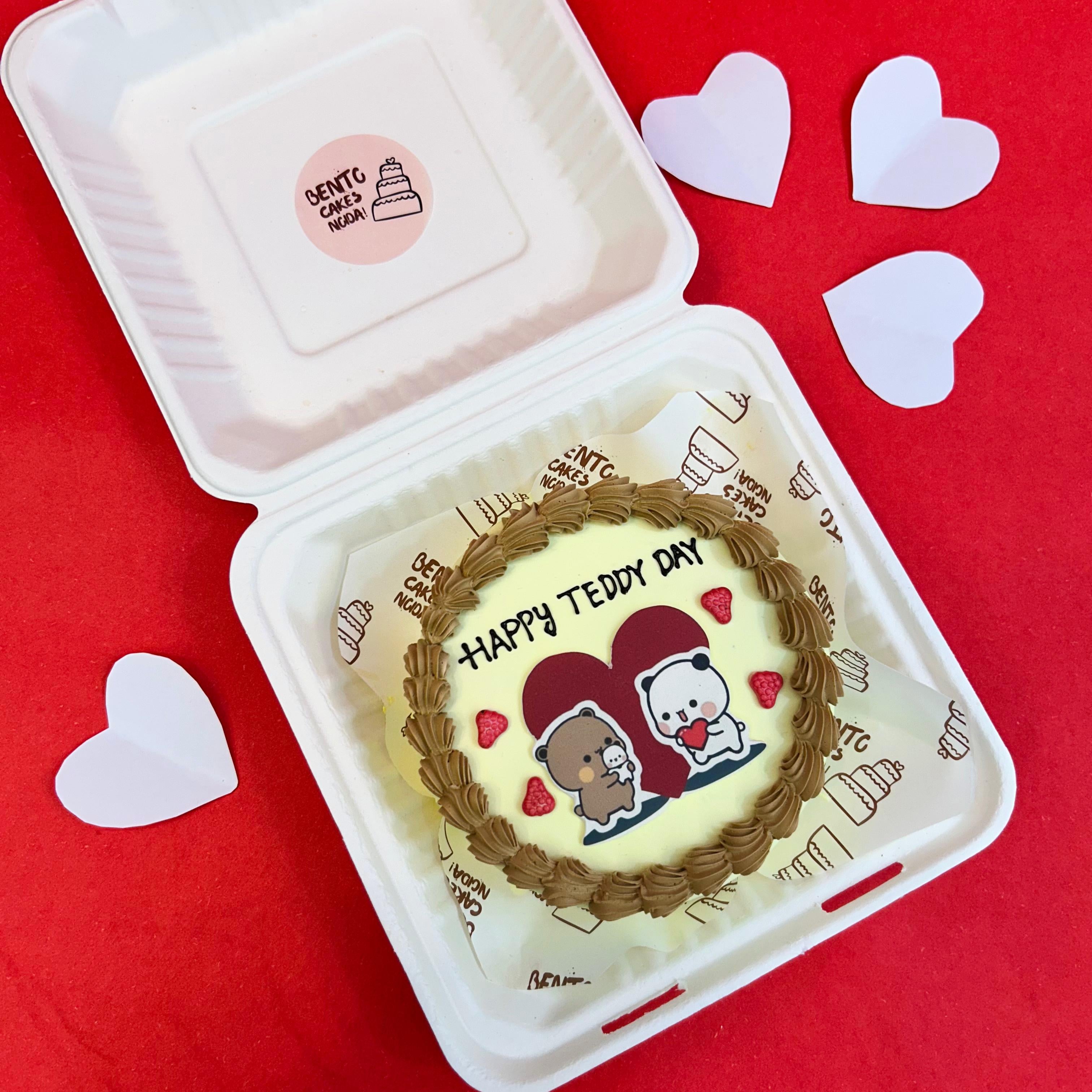 A cake adorned with a teddy bear and a heart, featuring the Bubu Dudu cartoon character for Teddy Day celebration.