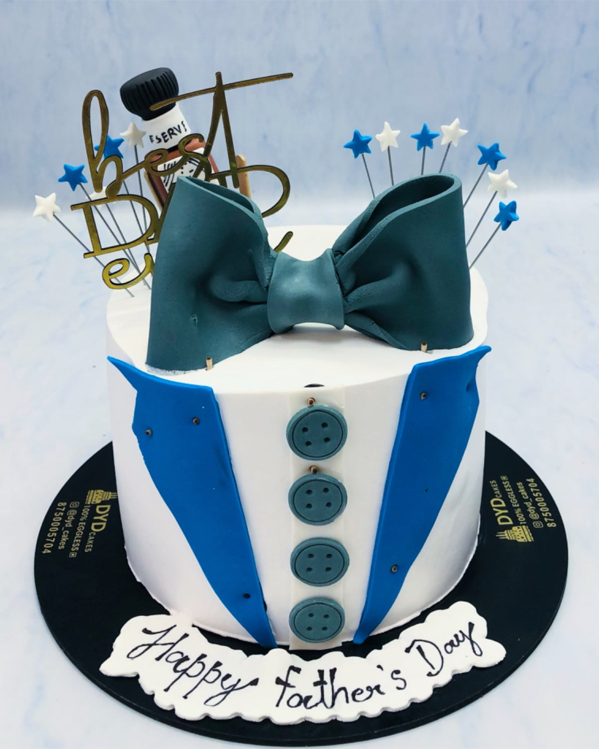 A white blue Tuxedo Fathers Day Theme Cake.