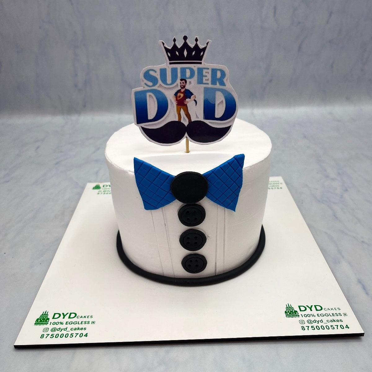 A Tuxedo design Super Daddy Theme Cake.