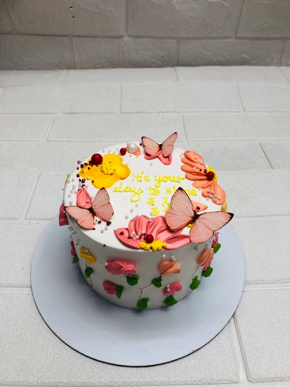 Pink Base with Colorful Flowers Celebration Cake